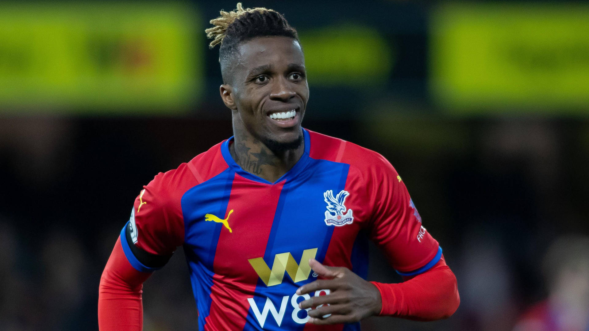 Wilfried Zaha Smiling While Running Background