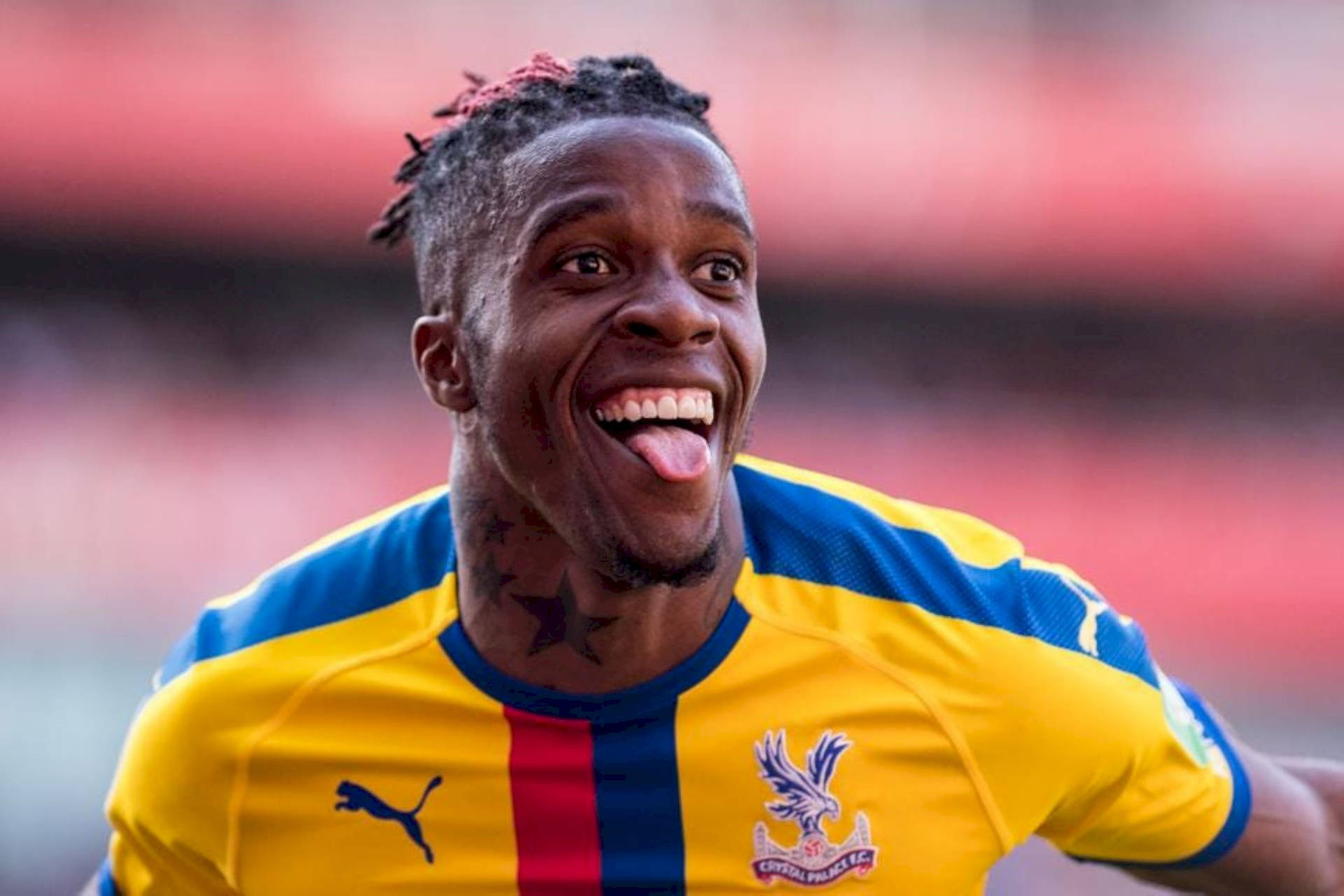 Wilfried Zaha Sticking His Tongue Out