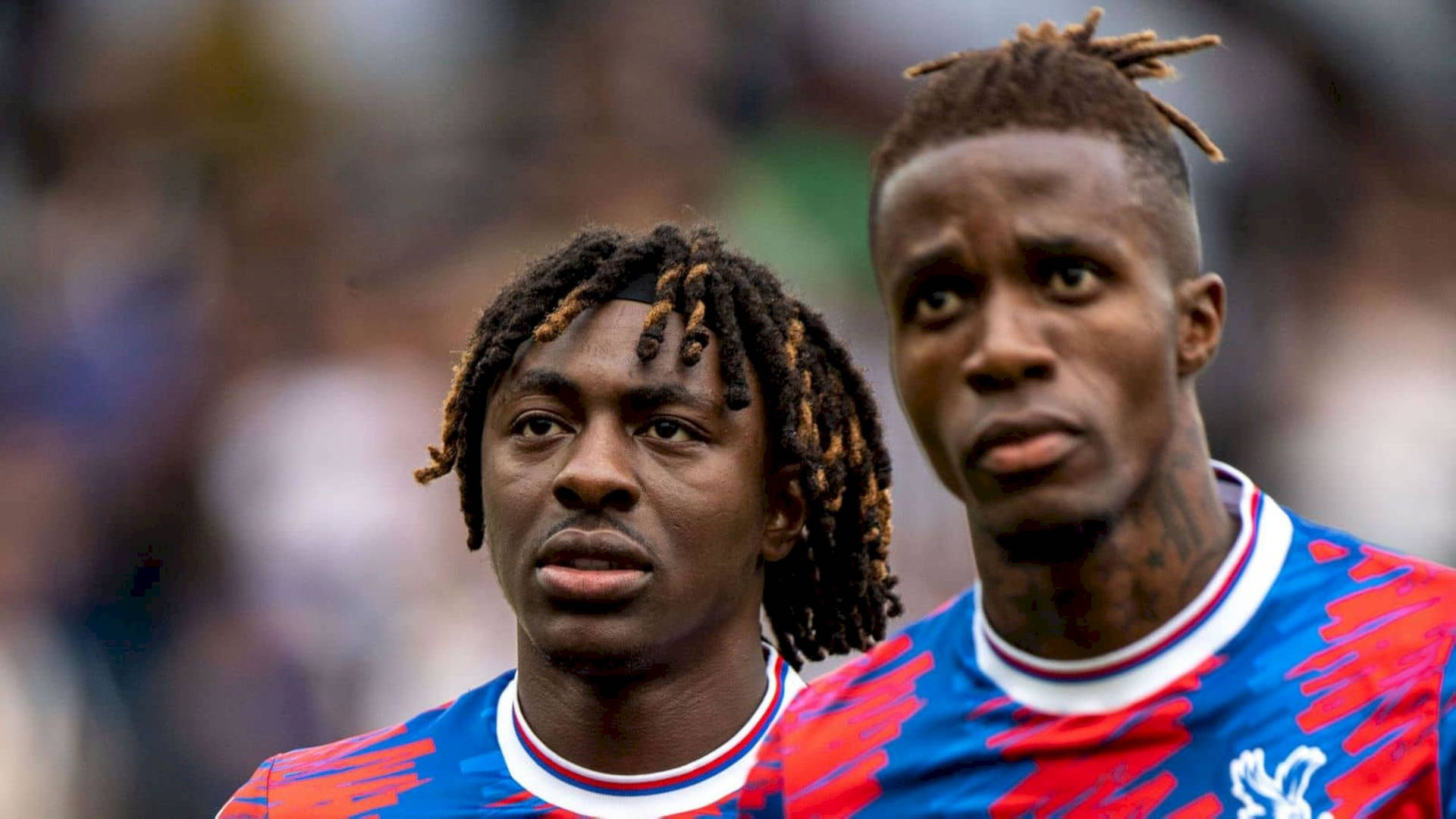 Wilfried Zaha With Teammate Background