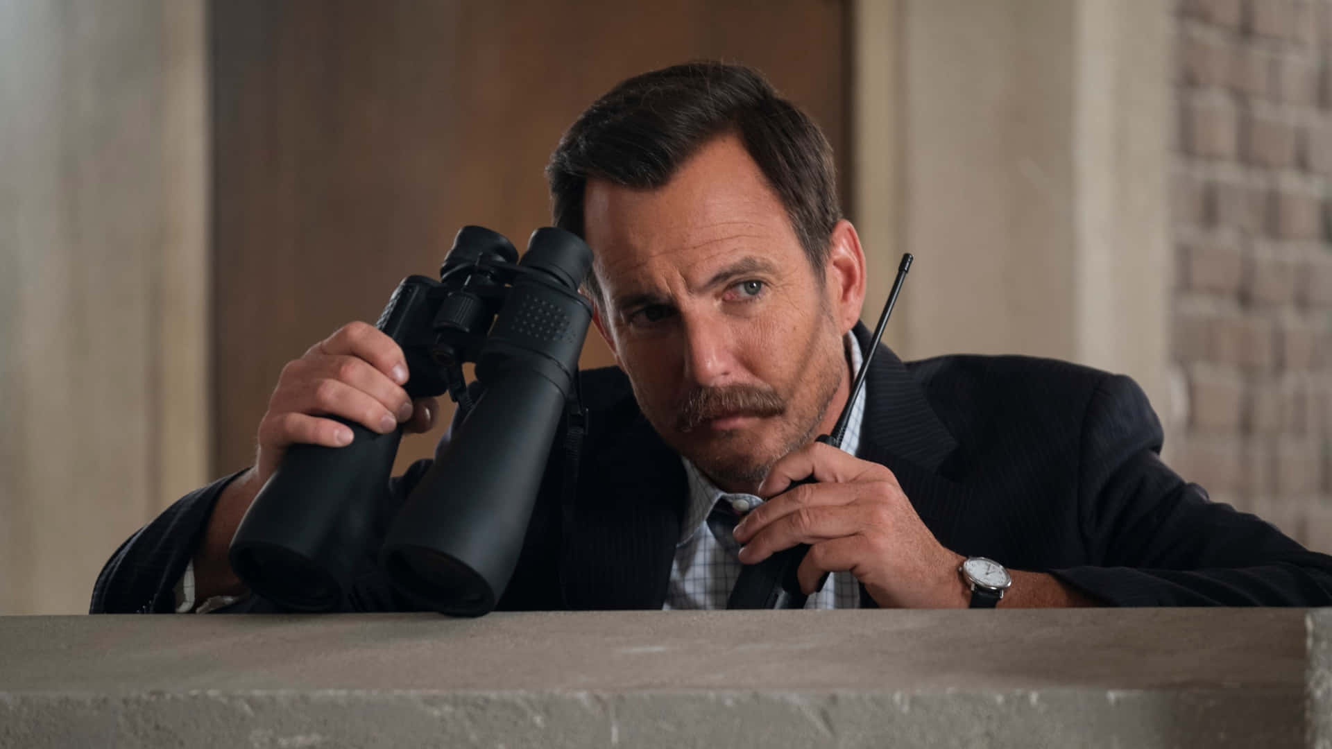 Will Arnett Posing For A Photoshoot Background
