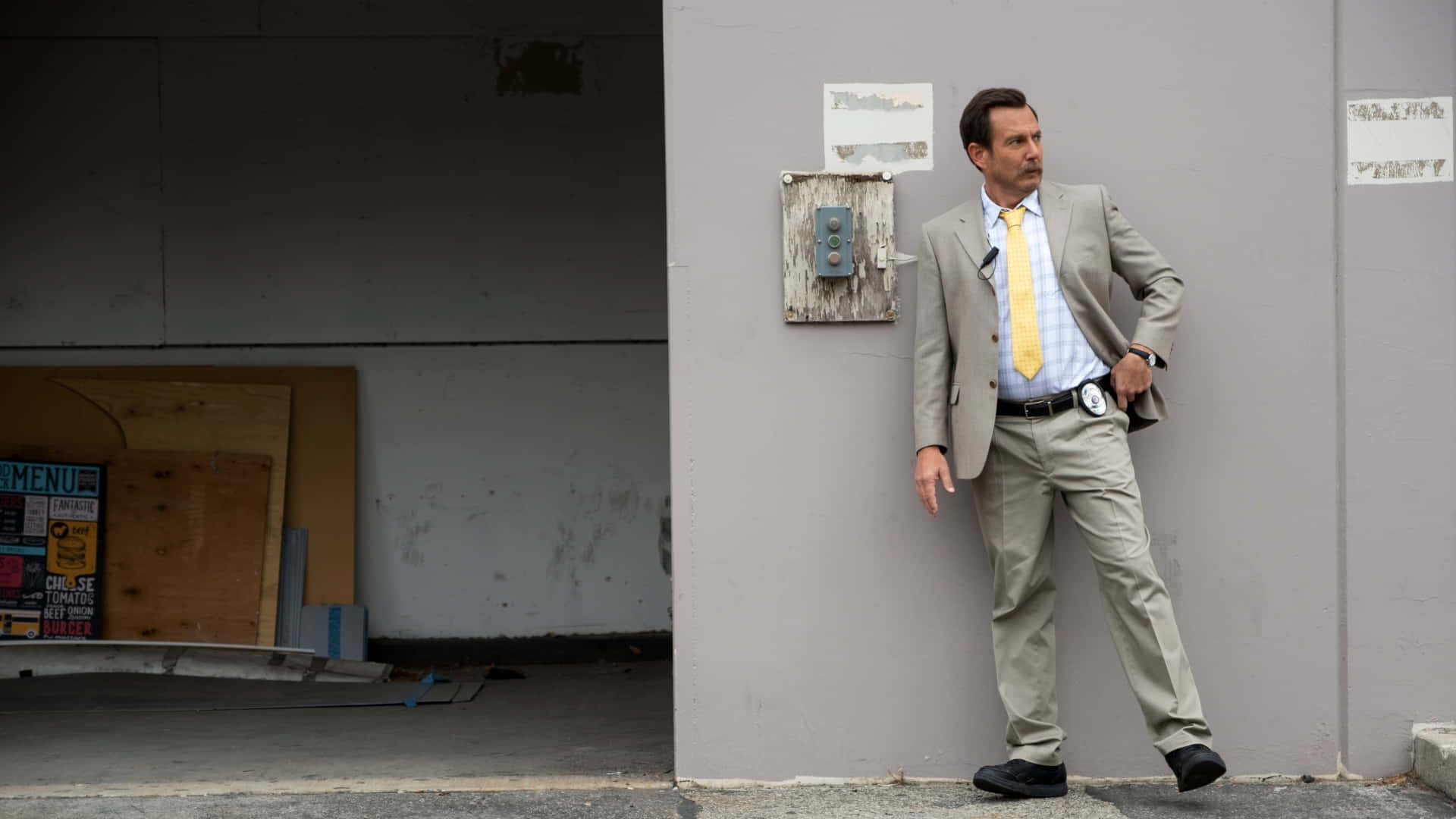 Will Arnett Striking A Pose At A Photoshoot Background