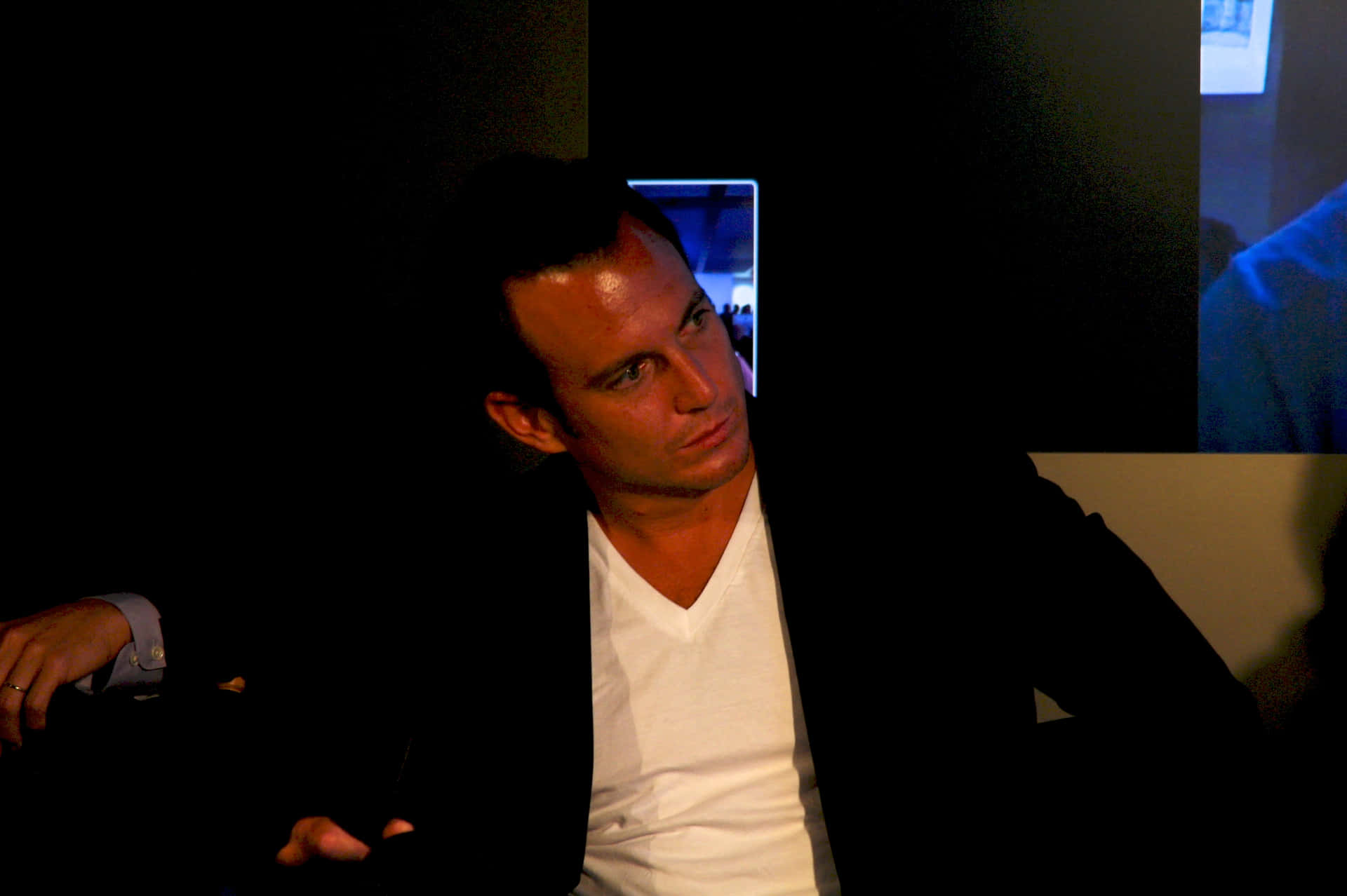Will Arnett Striking A Pose During A Photoshoot Background