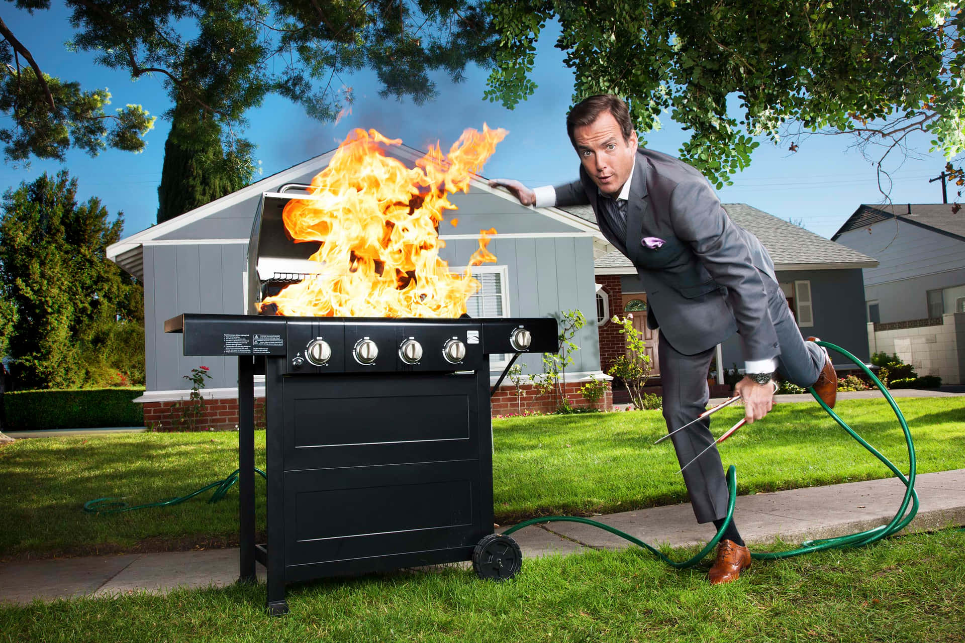 Will Arnett Striking A Pose In A Stylish Outfit Background
