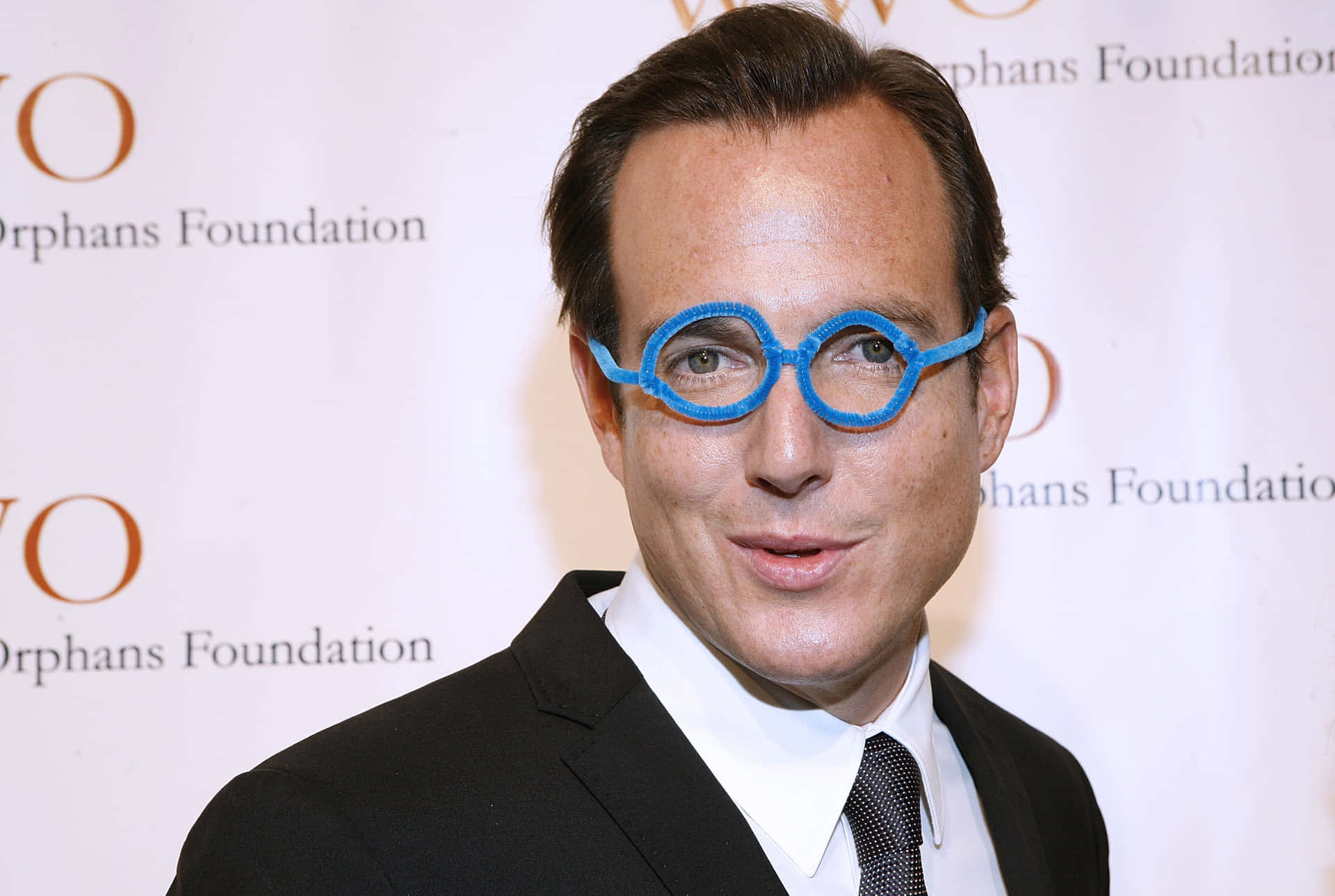 Will Arnett Striking A Pose In A Stylish Photoshoot. Background