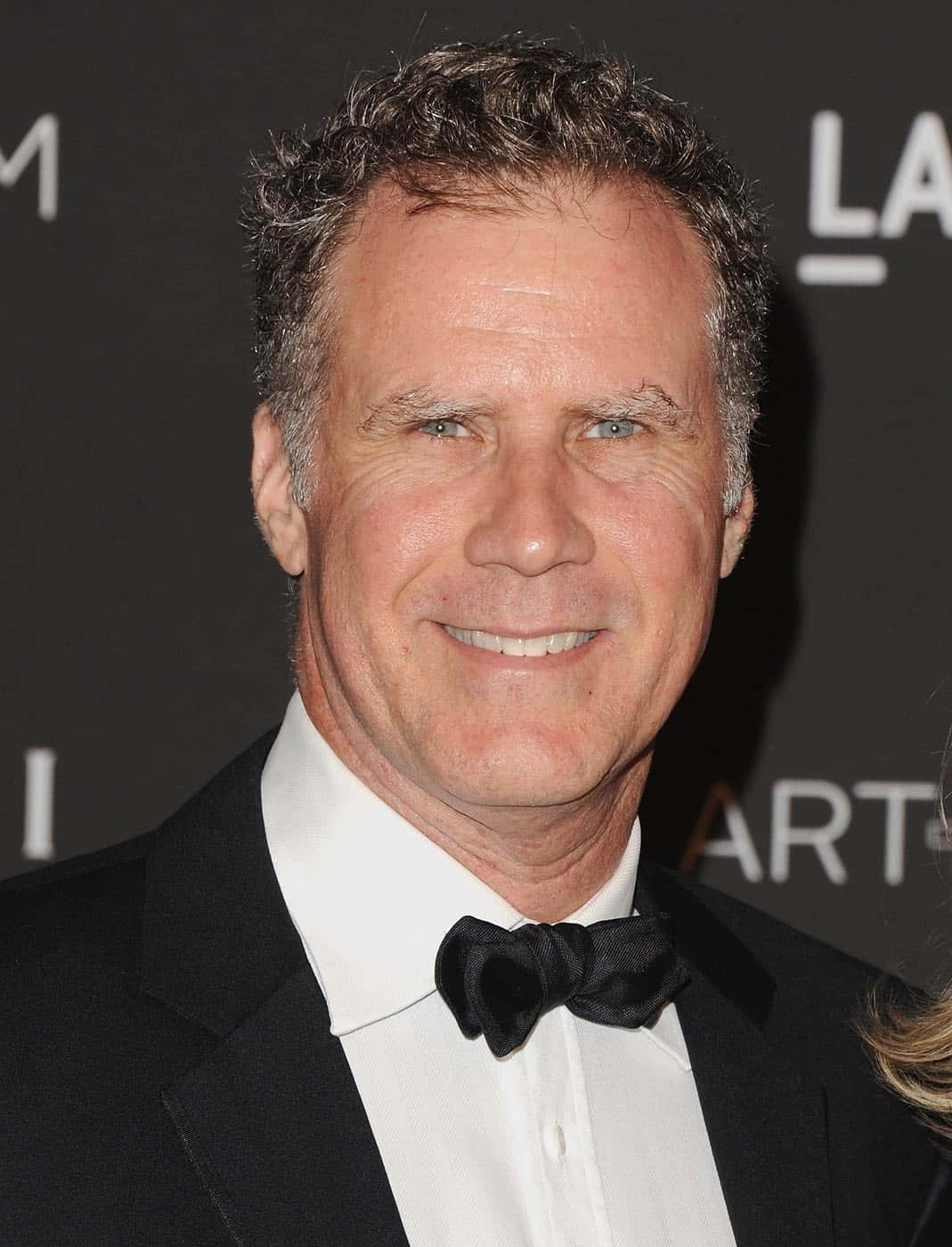 Will Ferrell Poses In A Semi-formal Attire Background