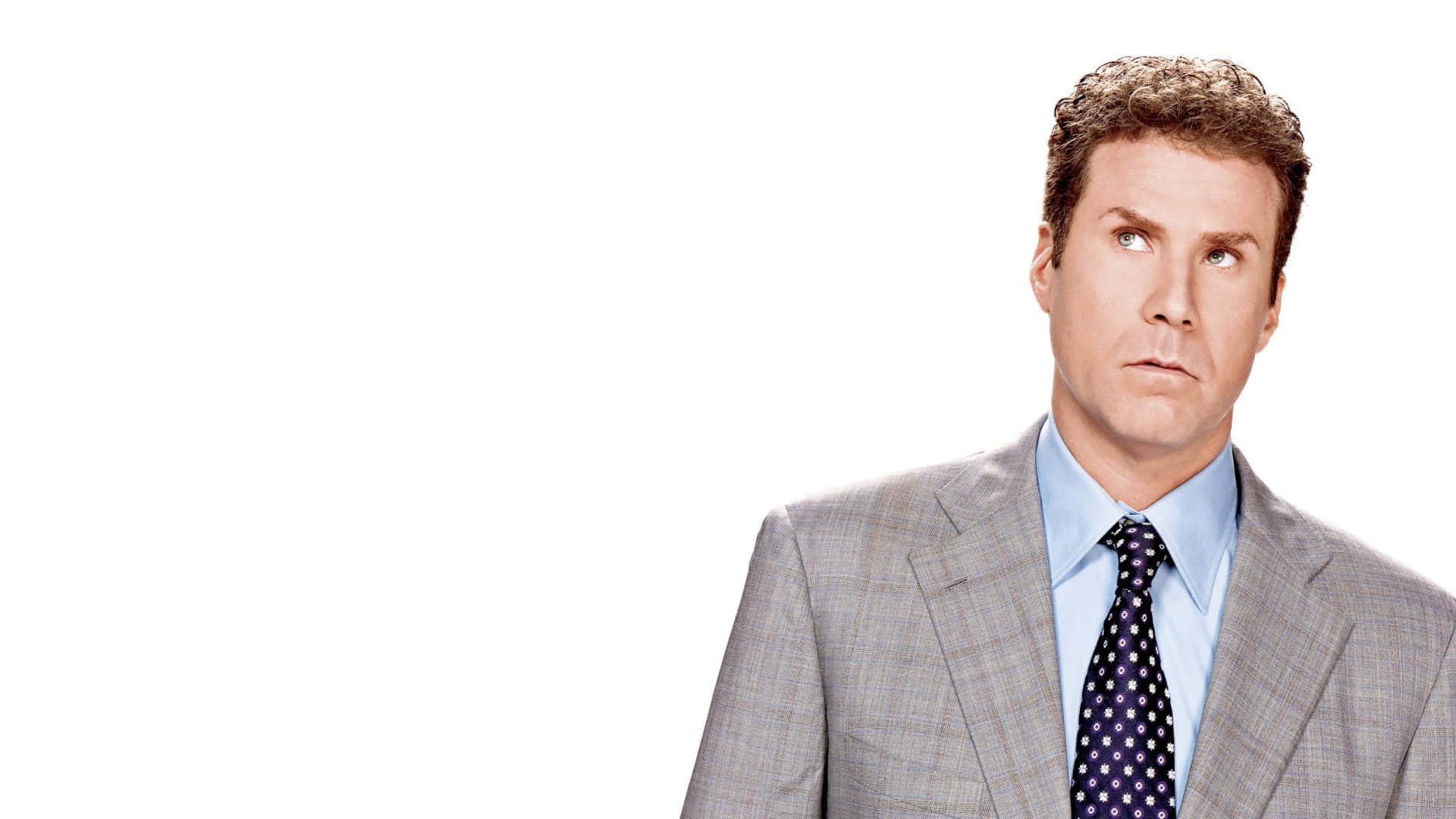 Will Ferrell Striking A Cool Pose Wearing A Blue Suit And Tie Background