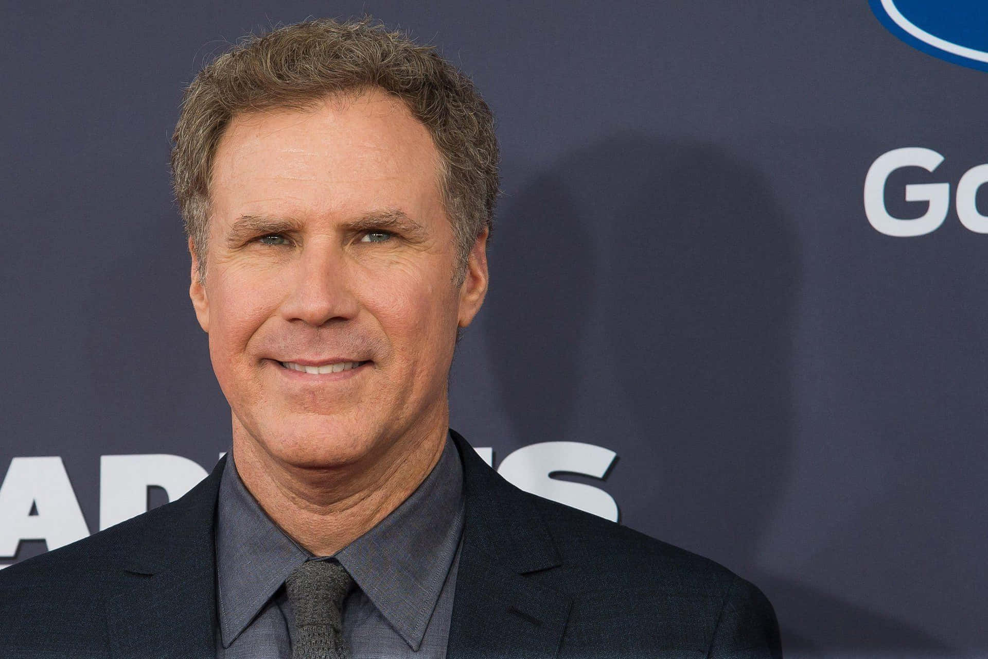 Will Ferrell Striking A Funny Pose While Holding A Basketball In A Promotional Photo Shoot. Background