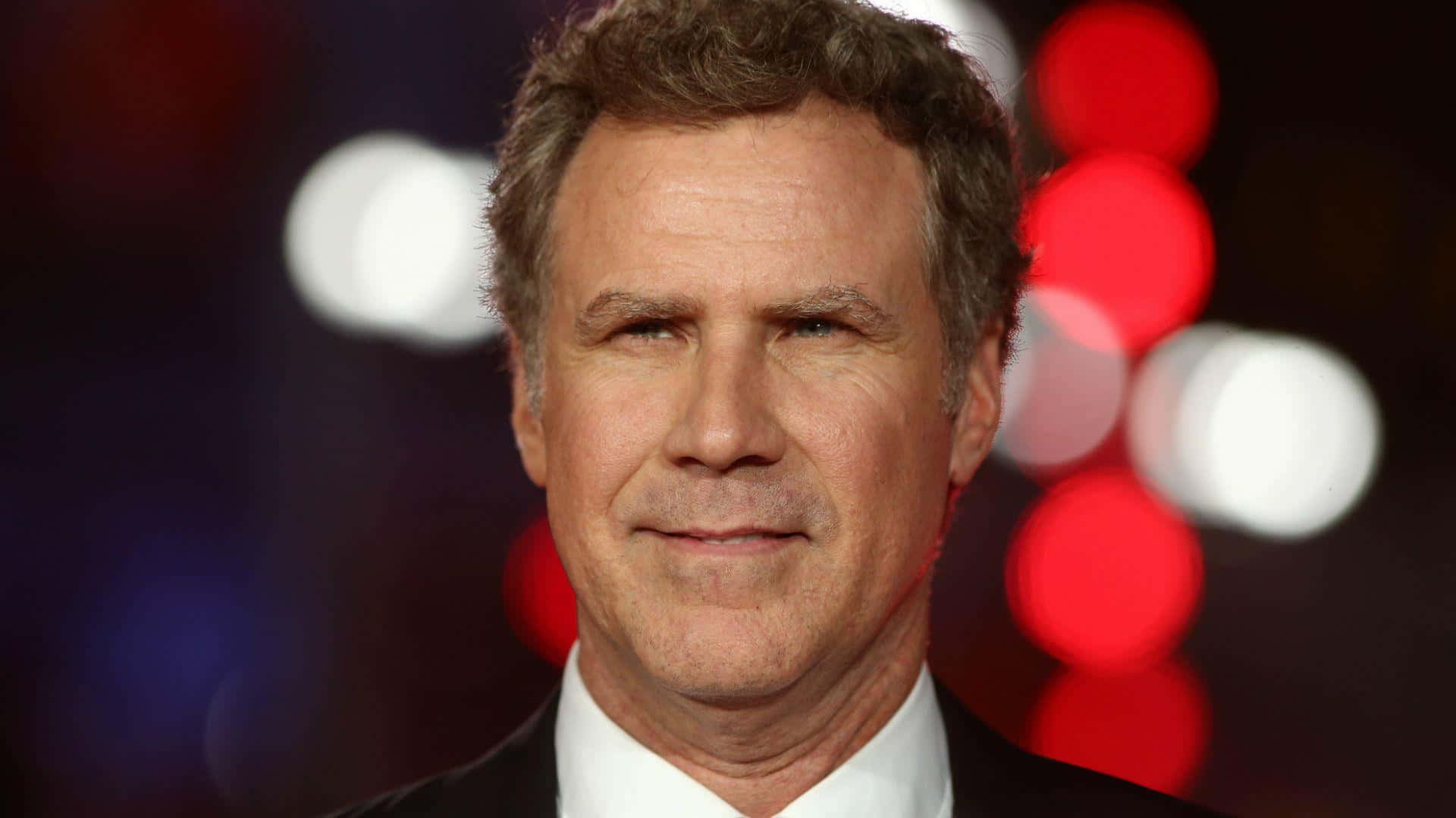 Will Ferrell Striking A Pose In A Classy Suit Background