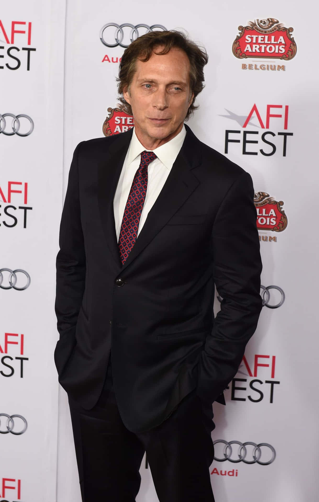 William Fichtner Striking A Pose At A Photo Shoot Background