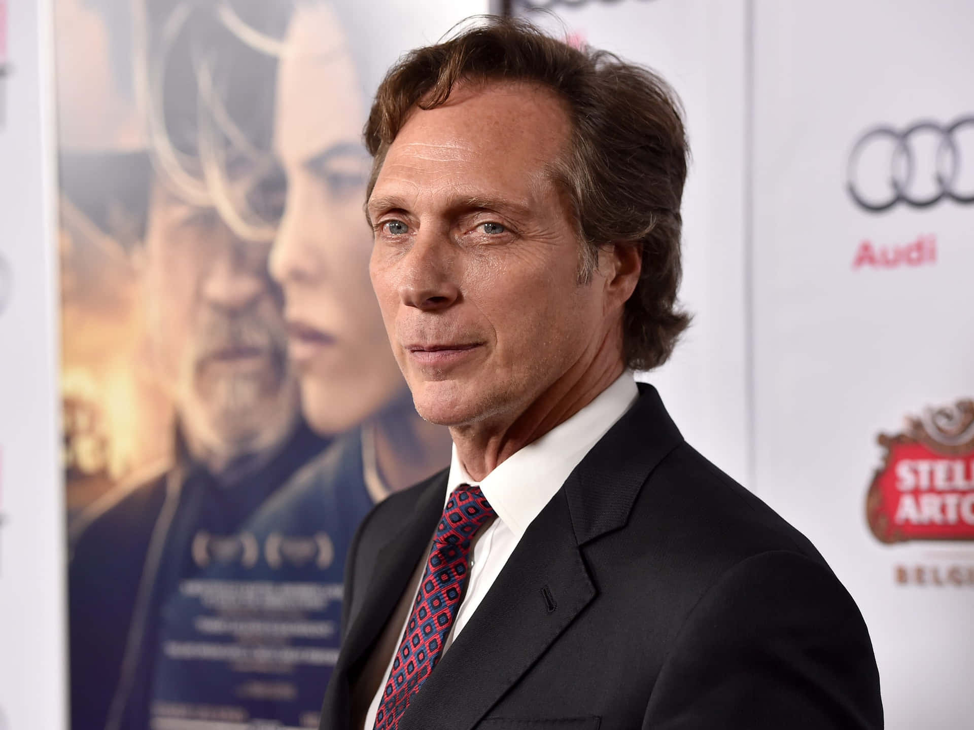William Fichtner Striking A Pose In A Photo Shoot Background