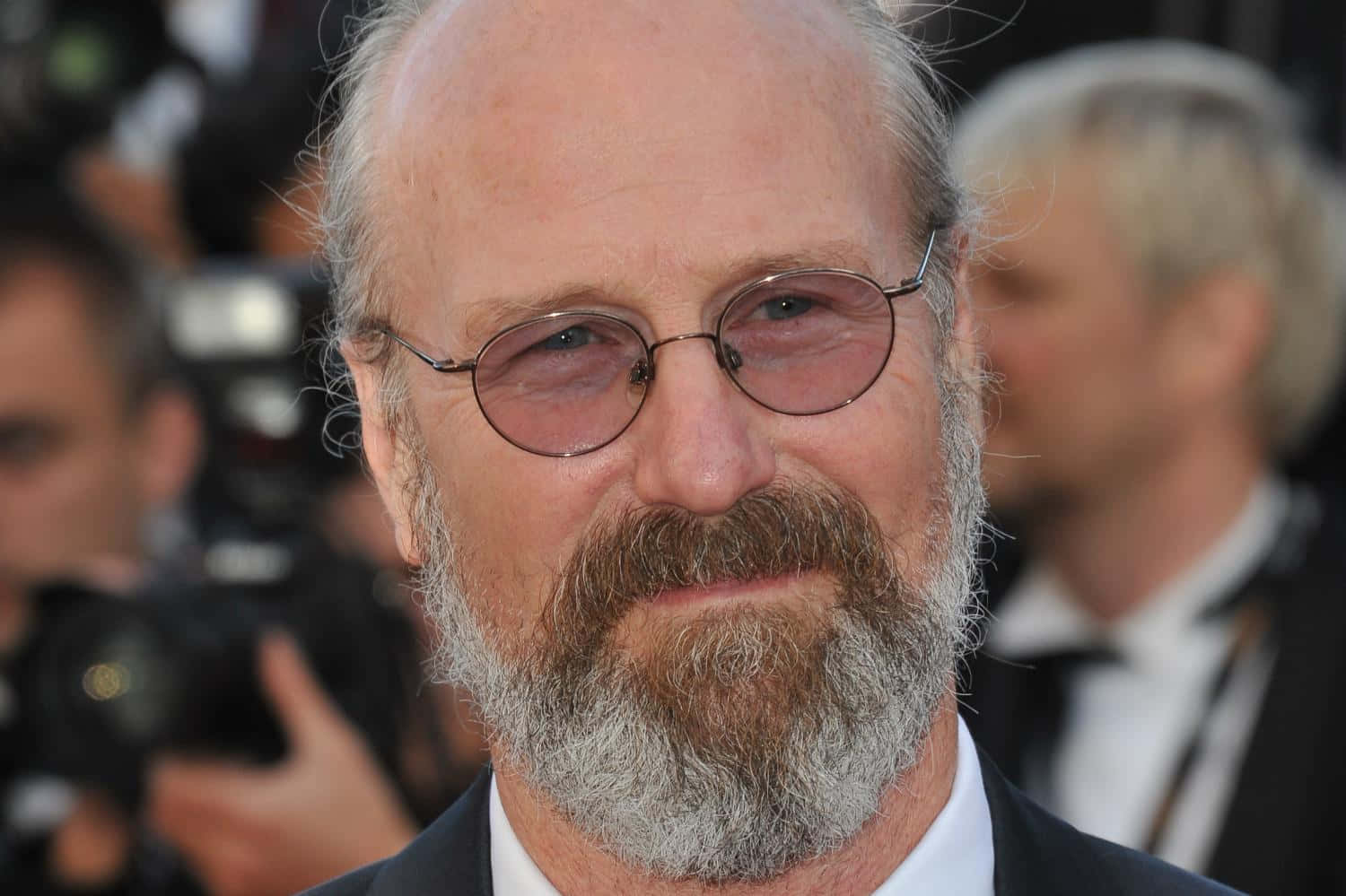 William Hurt Posing In A Photoshoot Background