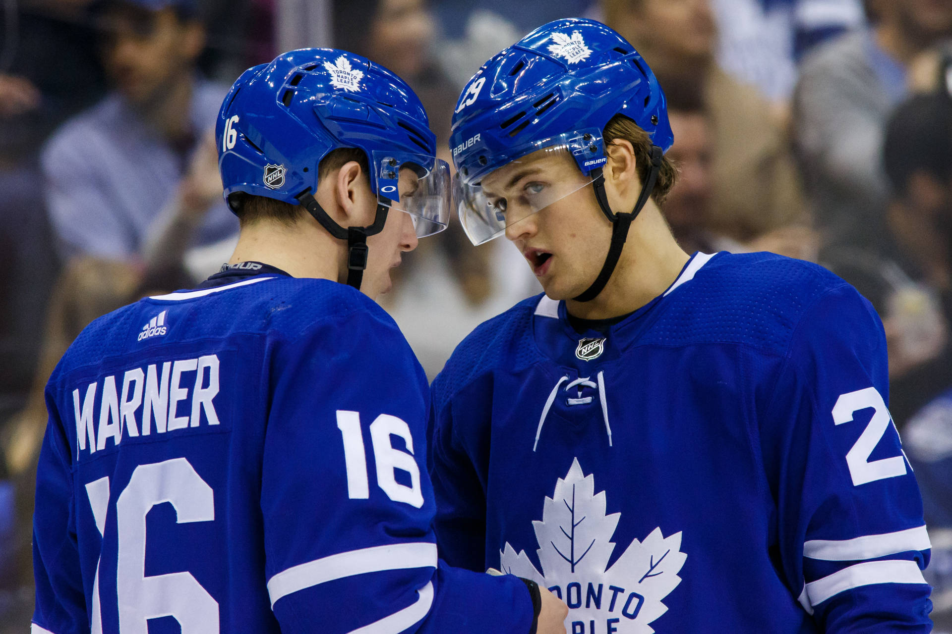 William Nylander And Mitch Marner In High Spirits On The Ice Background