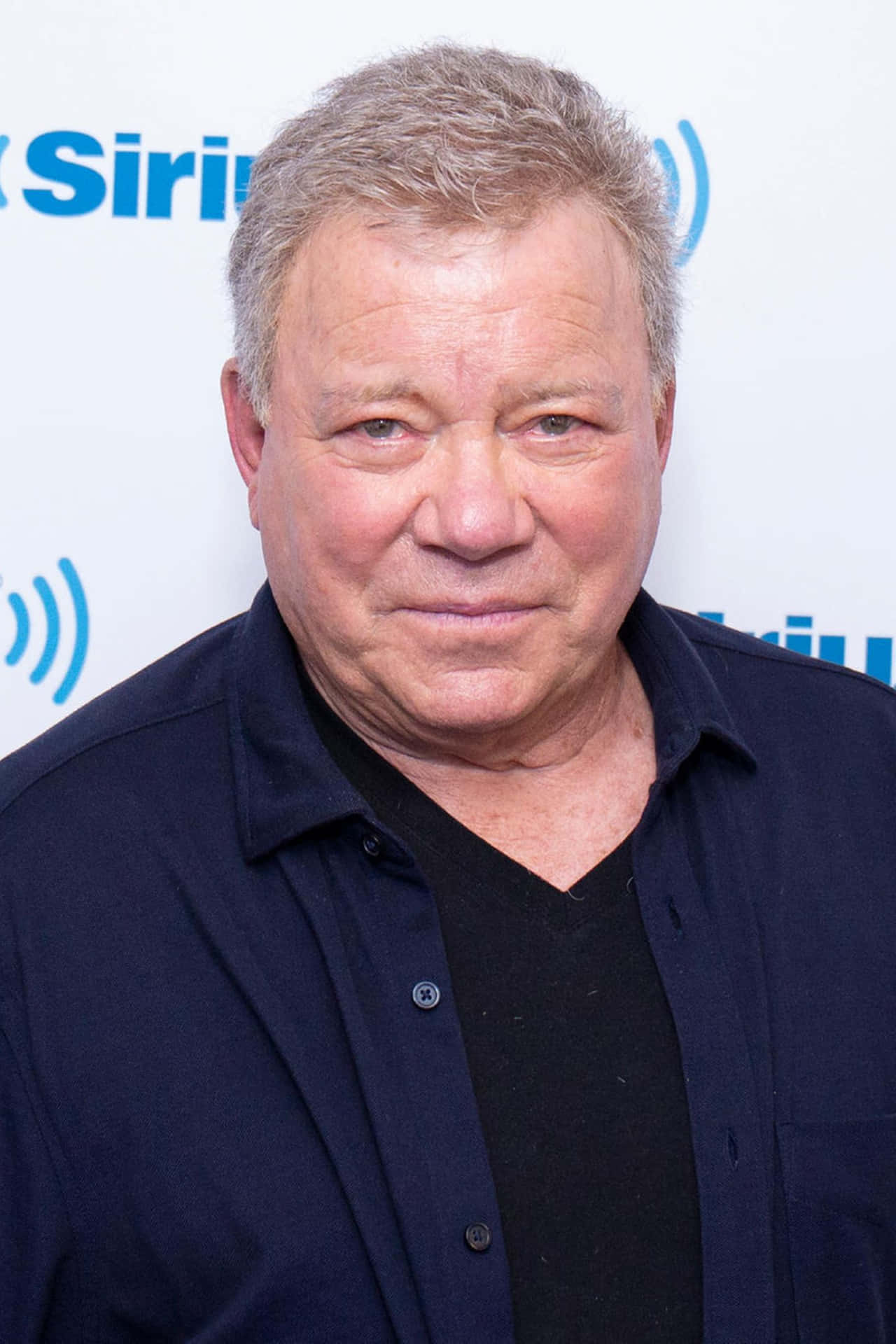 William Shatner Posing In A Blue Blazer