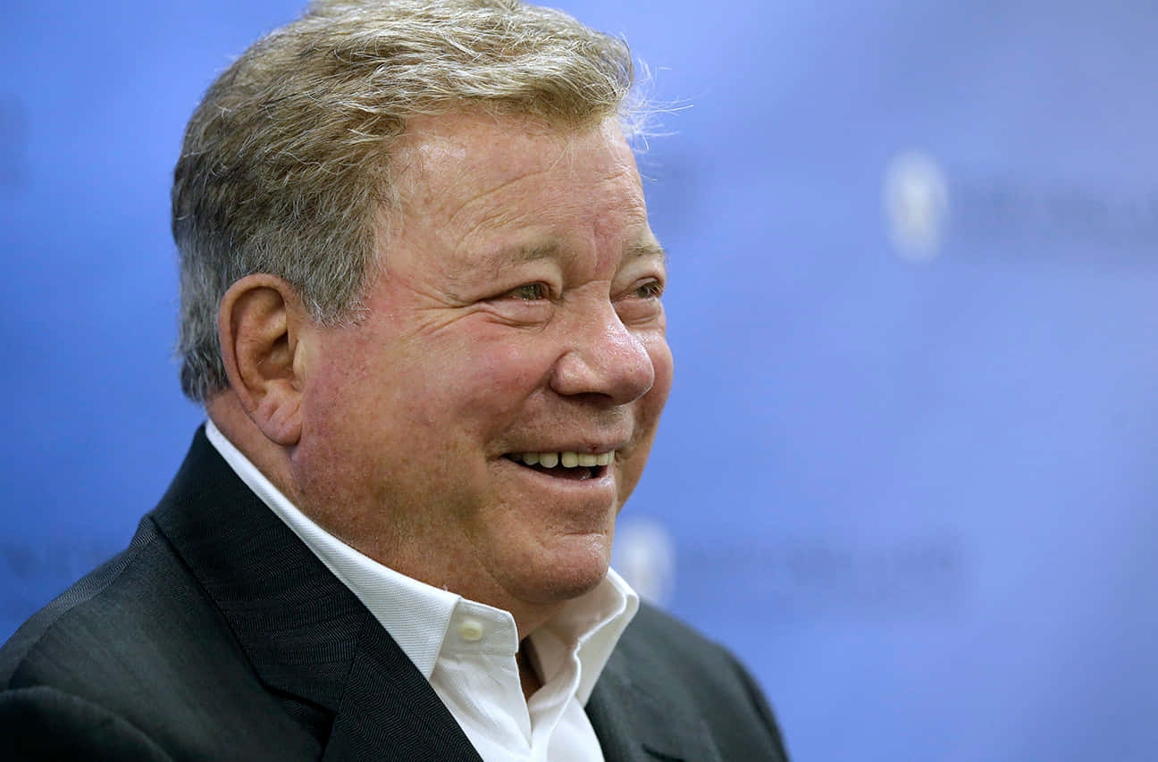 William Shatner Smiling At The Camera Background