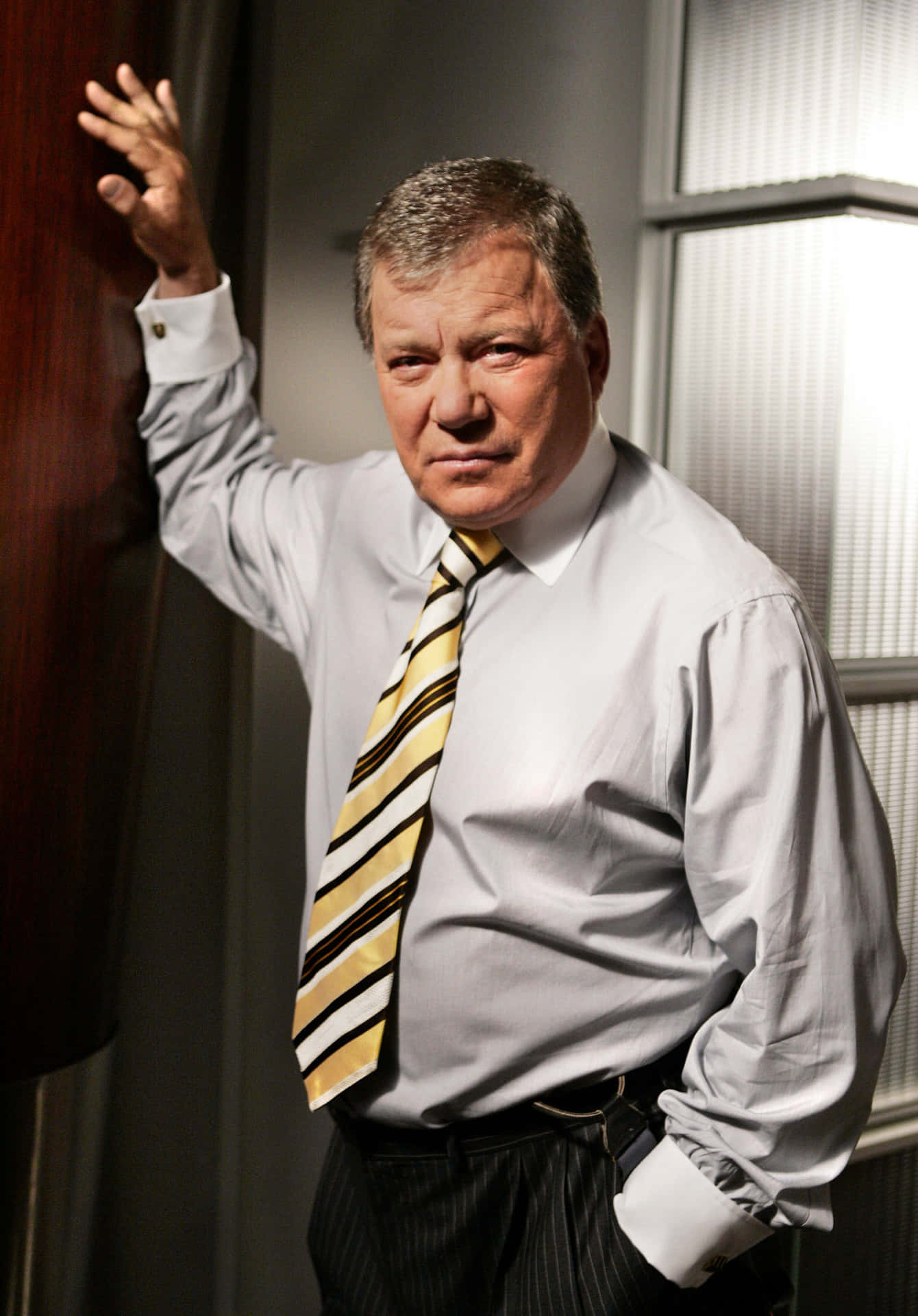 William Shatner Striking A Pose Background