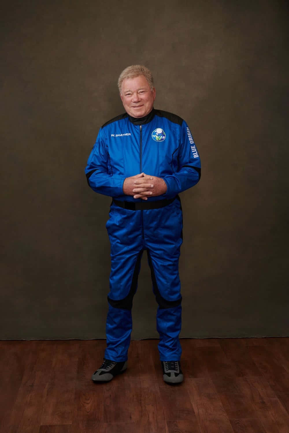 William Shatner Striking A Reflective Pose Background