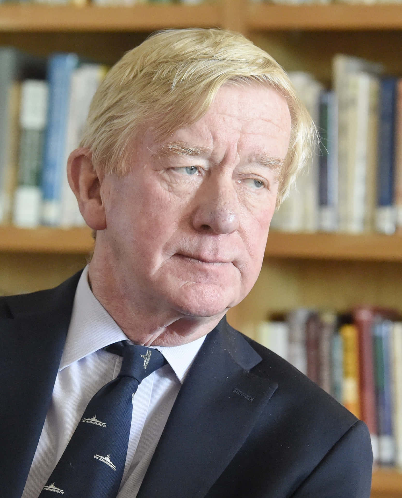 William Weld Against Book Shelves