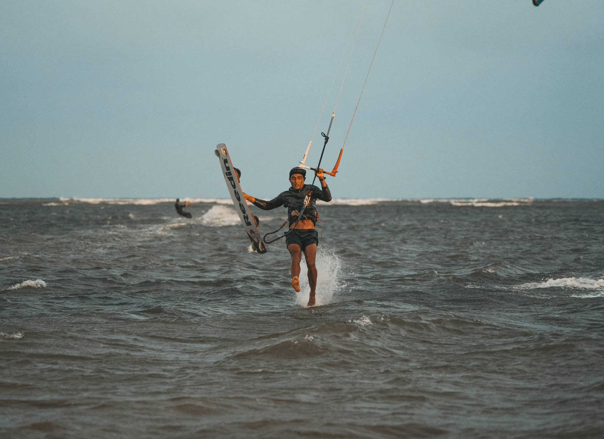 Windsurfing And Walking In Ocean Background