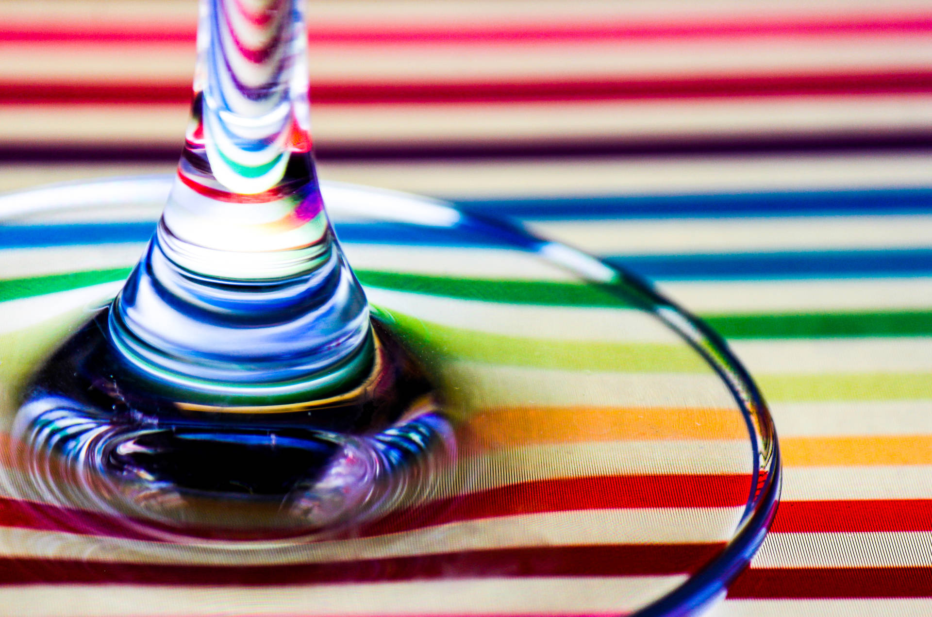 Wine Glass On Rainbow Stripes Surface Background