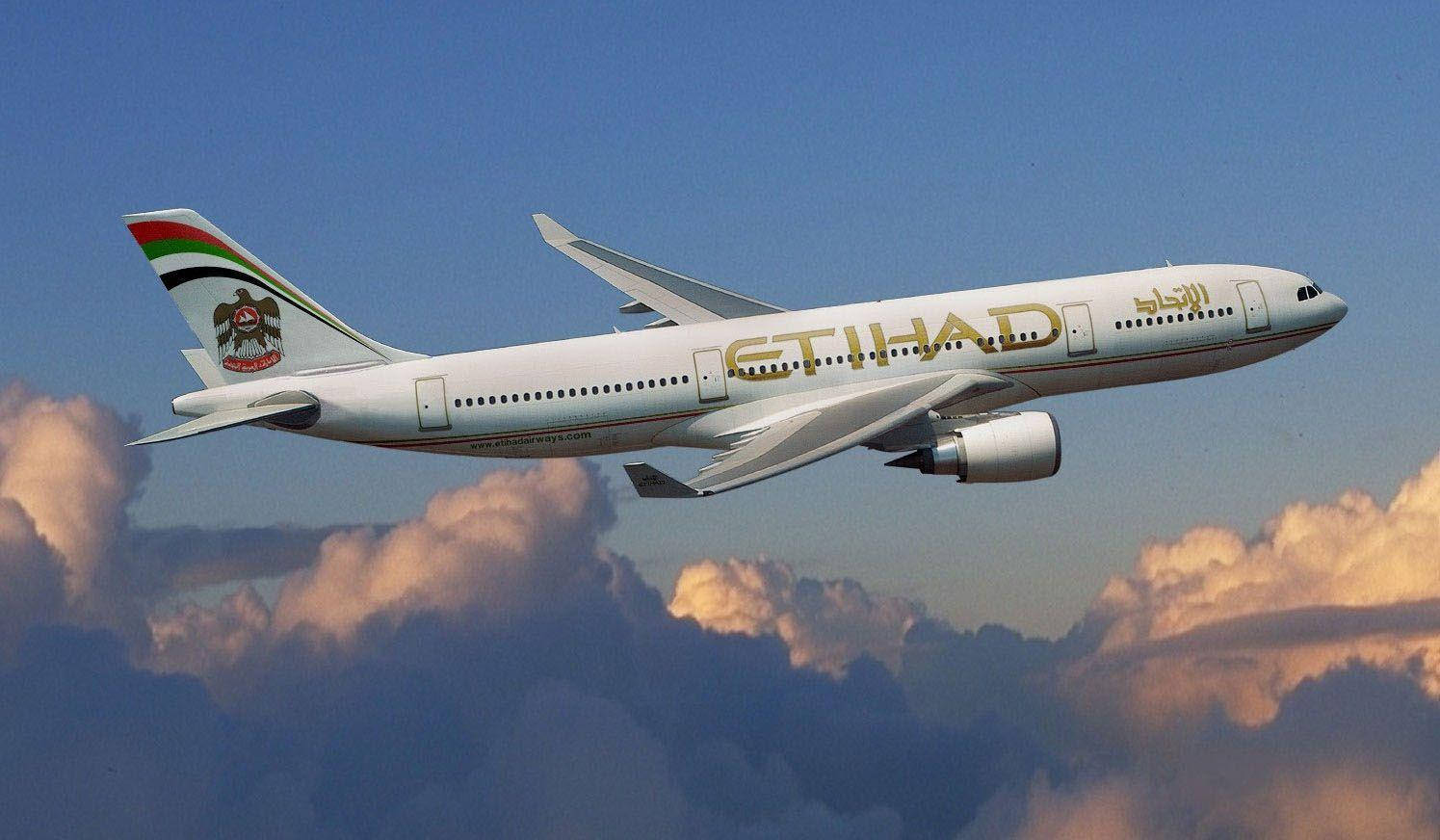 Winging Etihad Airplane With The Clouds Background