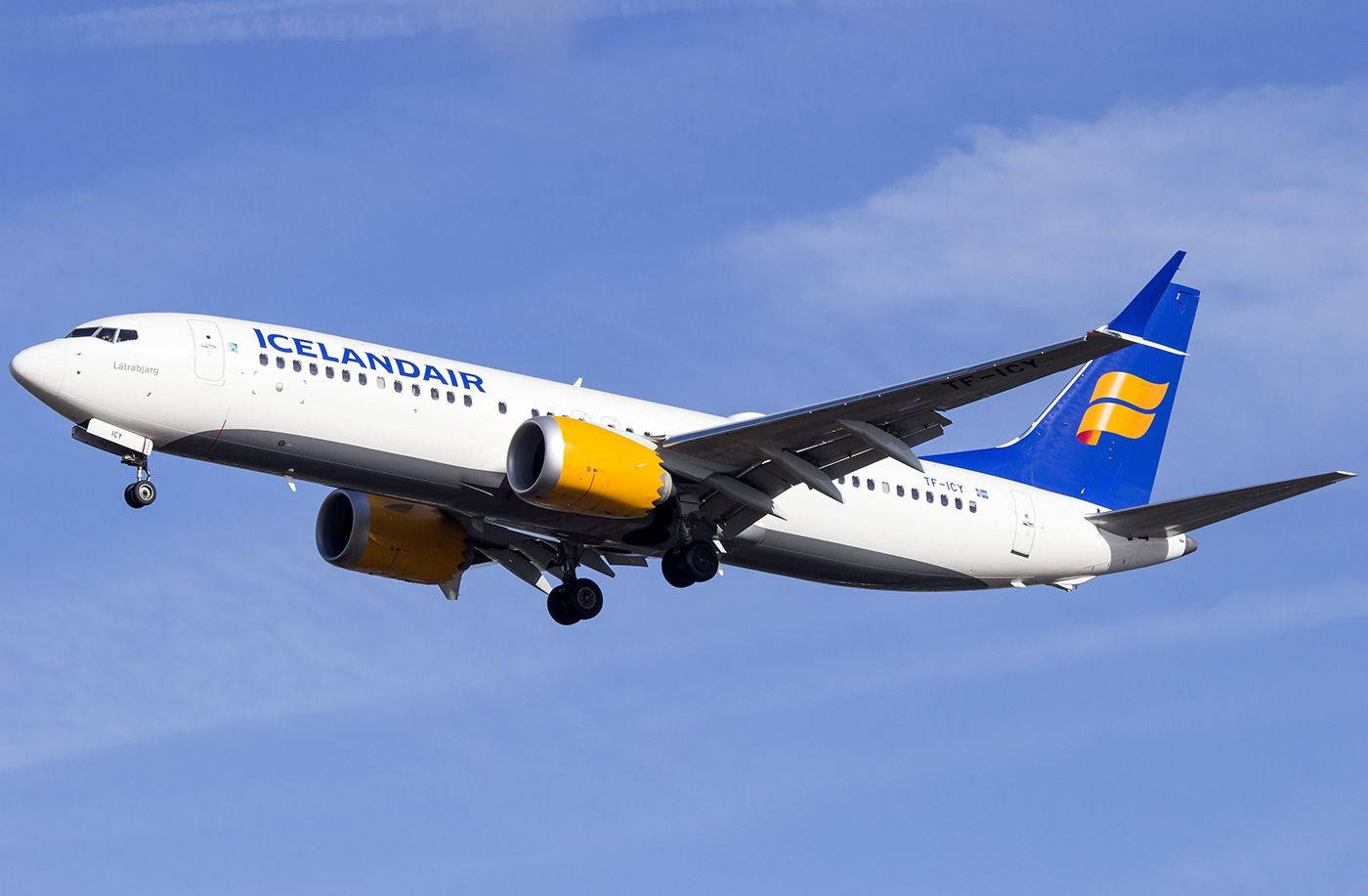 Winging Icelandair Airplane Under The Sky Background