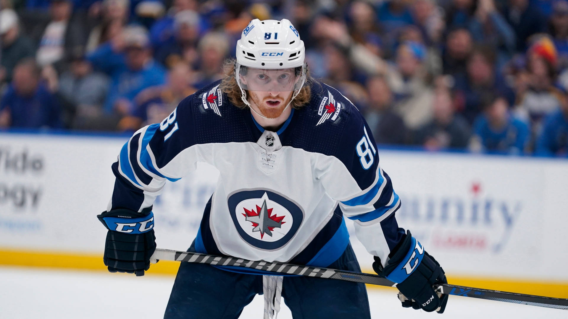 Winnipeg Jets Forward Player Kyle Connor Against St. Louis Blues Background