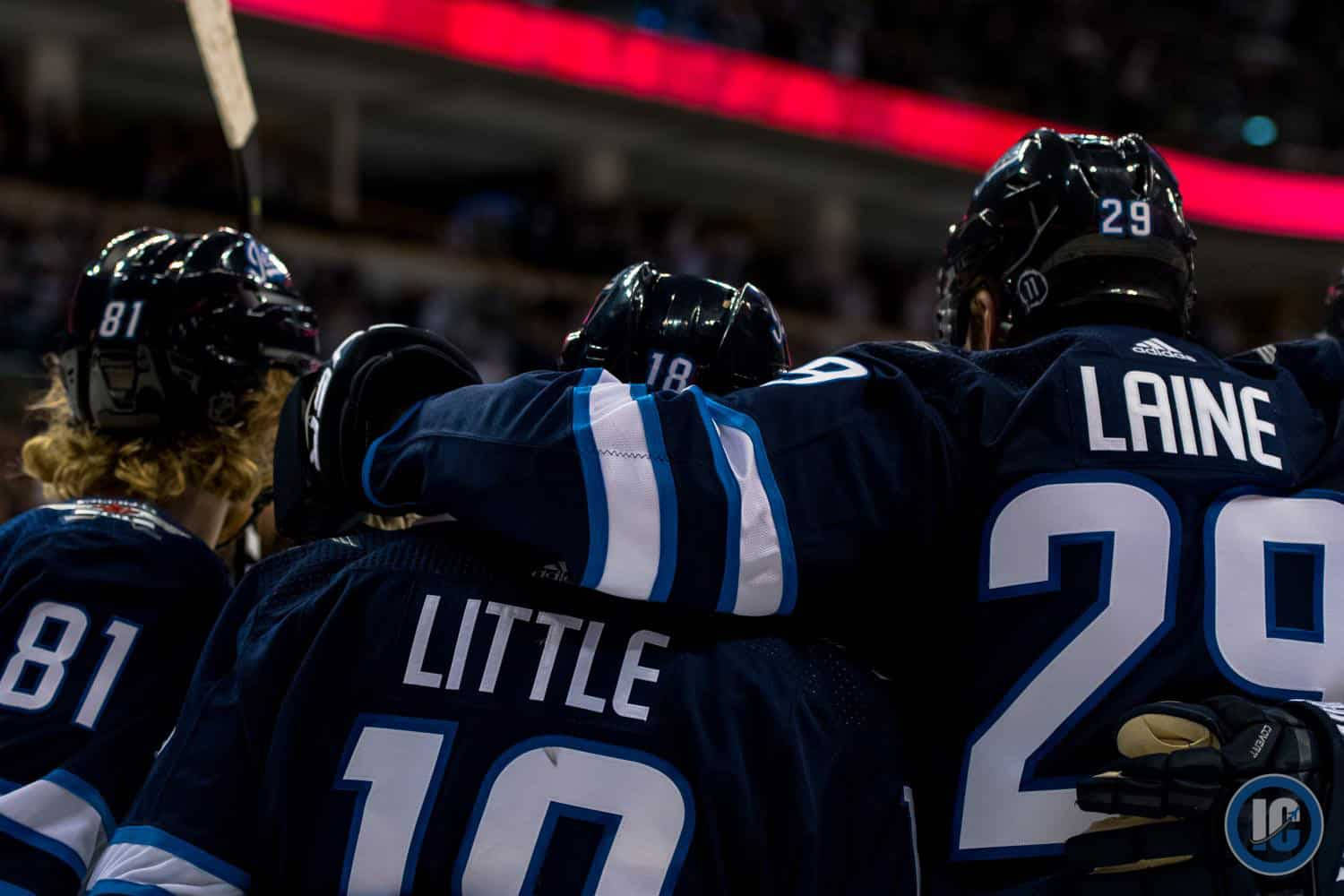 Winnipeg Jets Players Kyle Connor Bryan Little And Patrick Laine Background