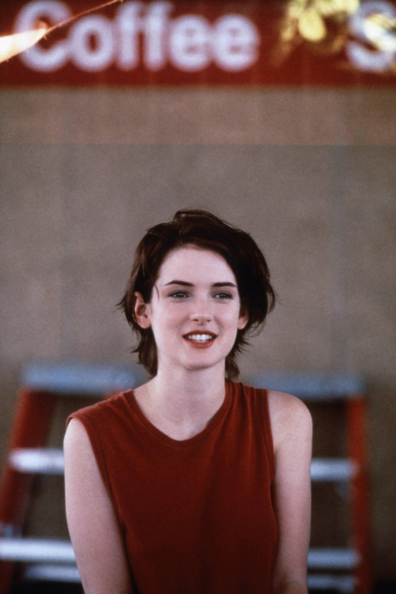 Winona Ryder At A Coffee Shop Background