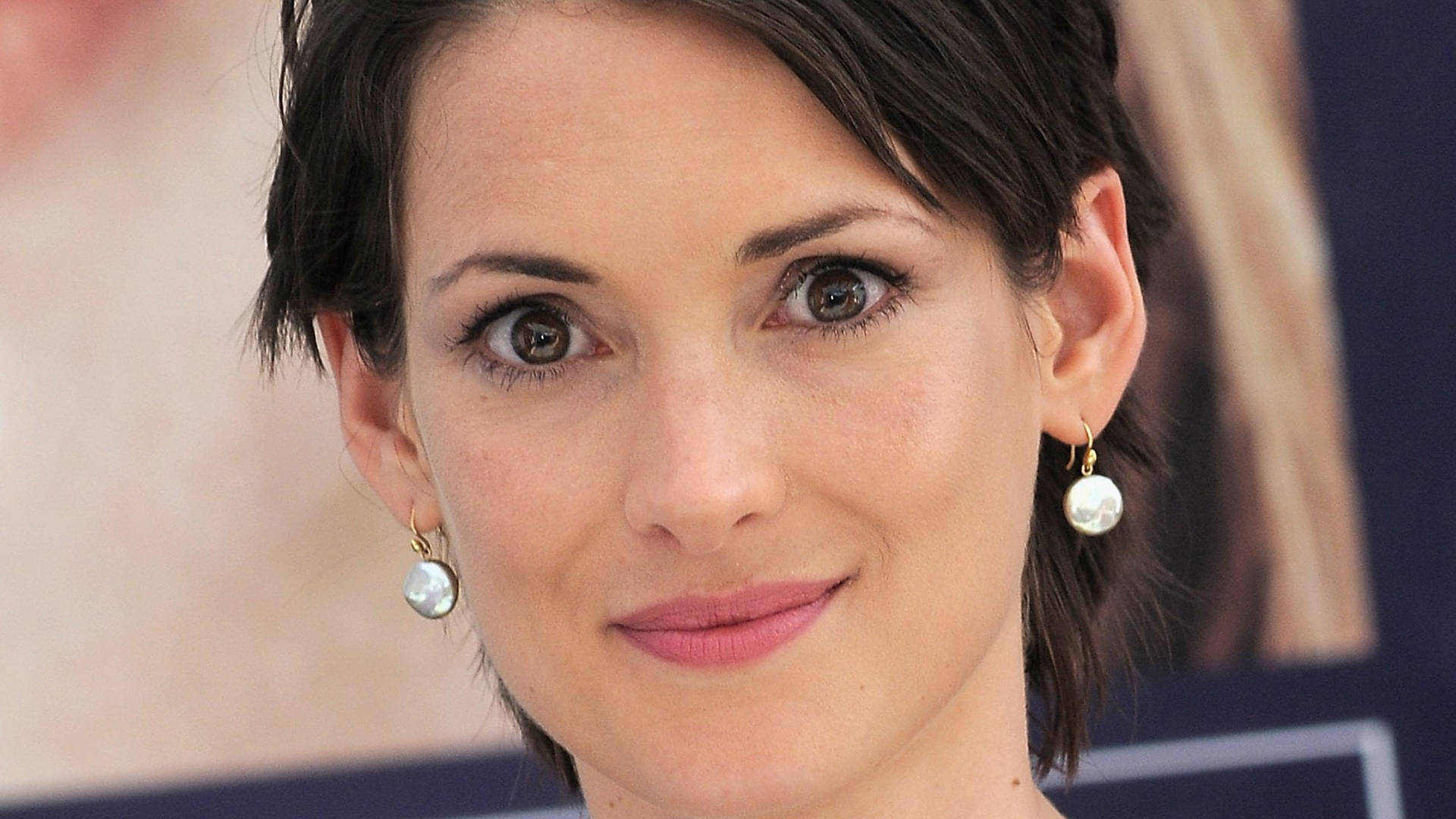 Winona Ryder Wearing Pearl Earrings Background