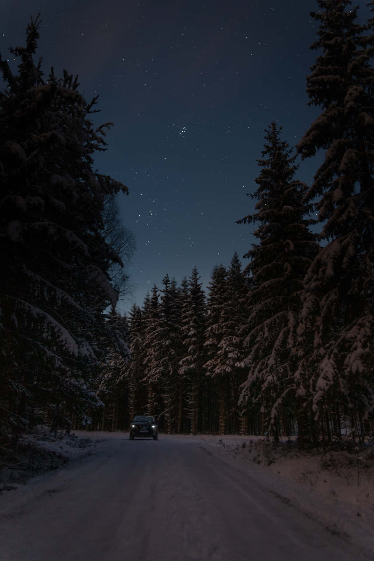 Winter Night Desktop With A Car Driving Background