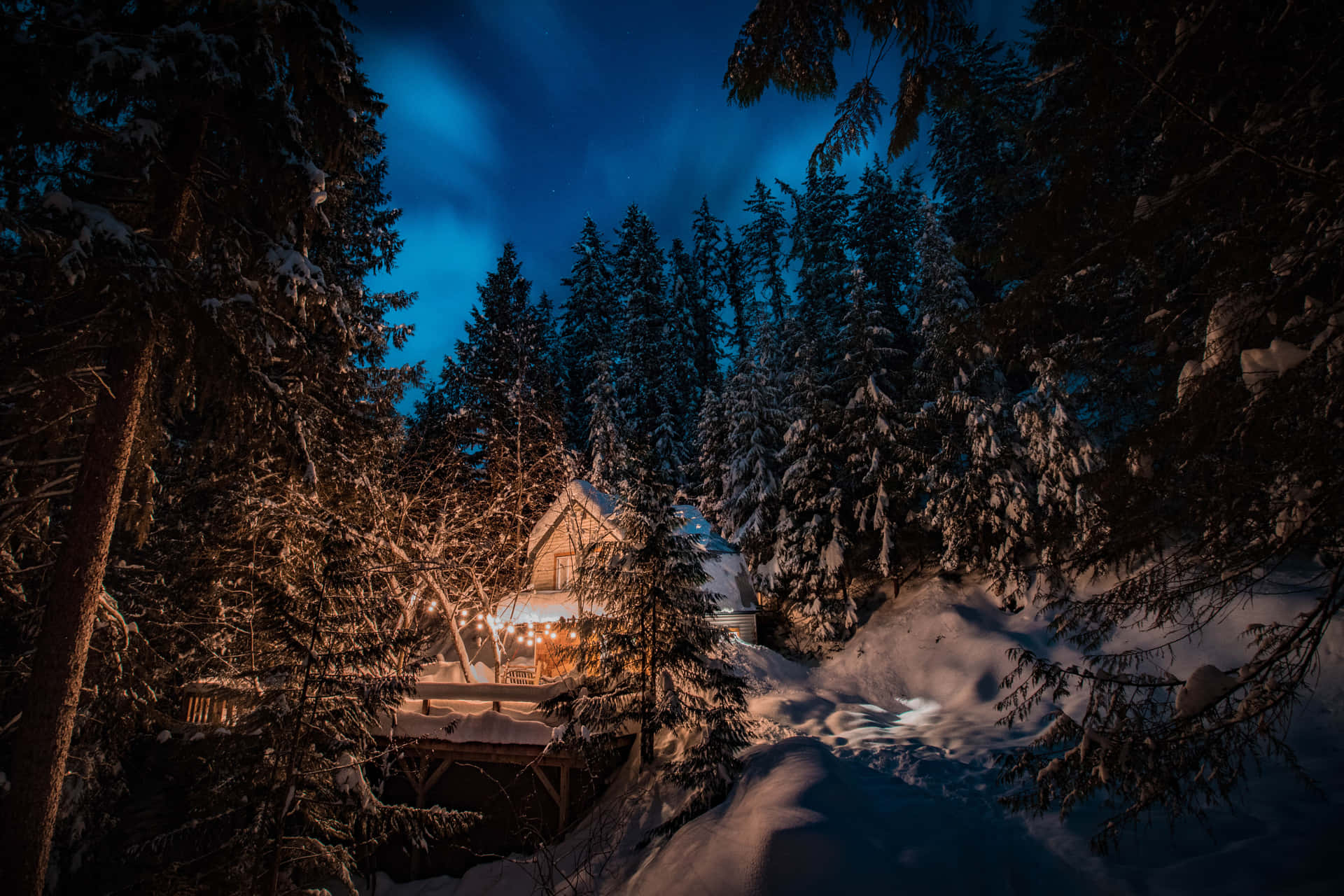 Winter Night Desktop With Cabin In The Woods Background