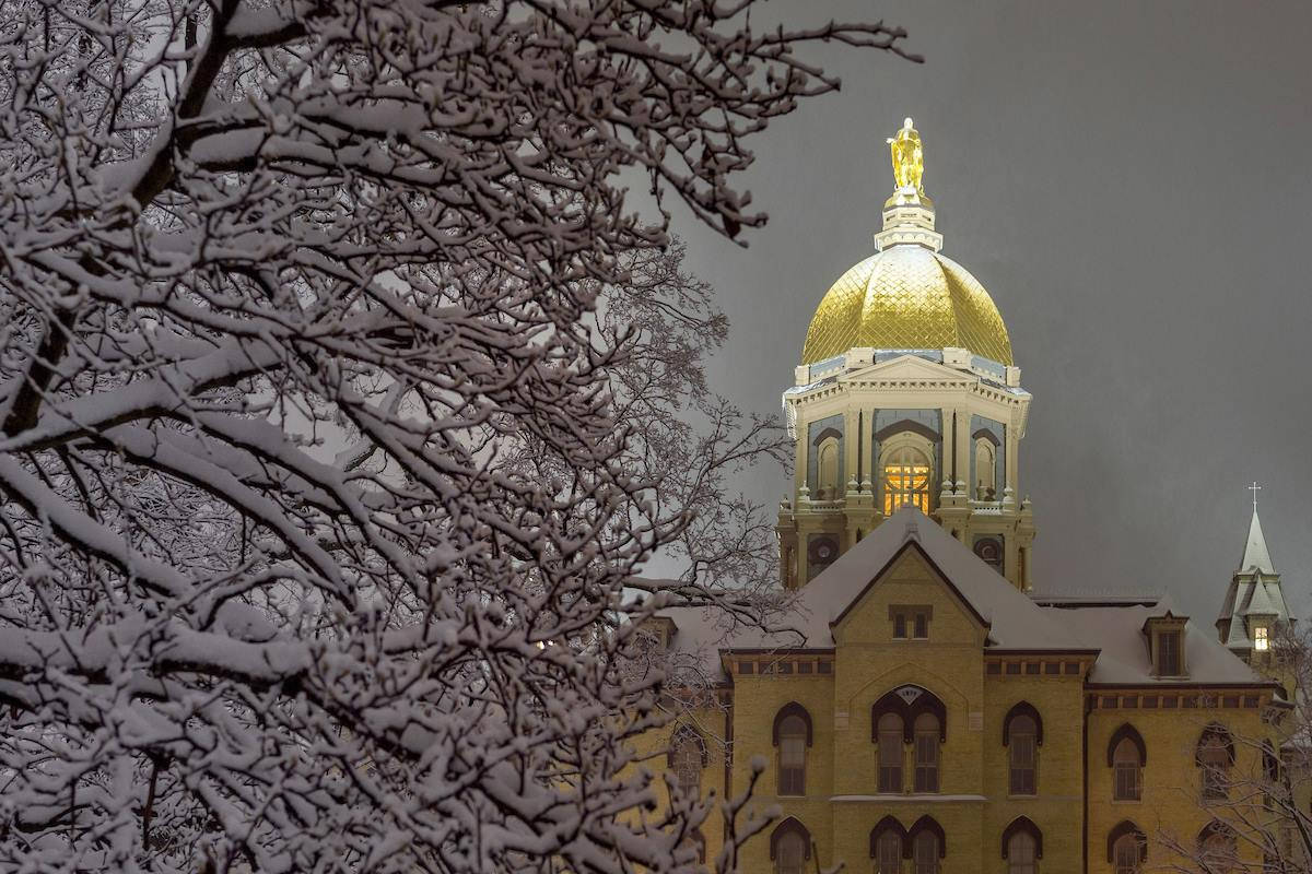 Wintry University Of Notre Dame Golden Dome Background