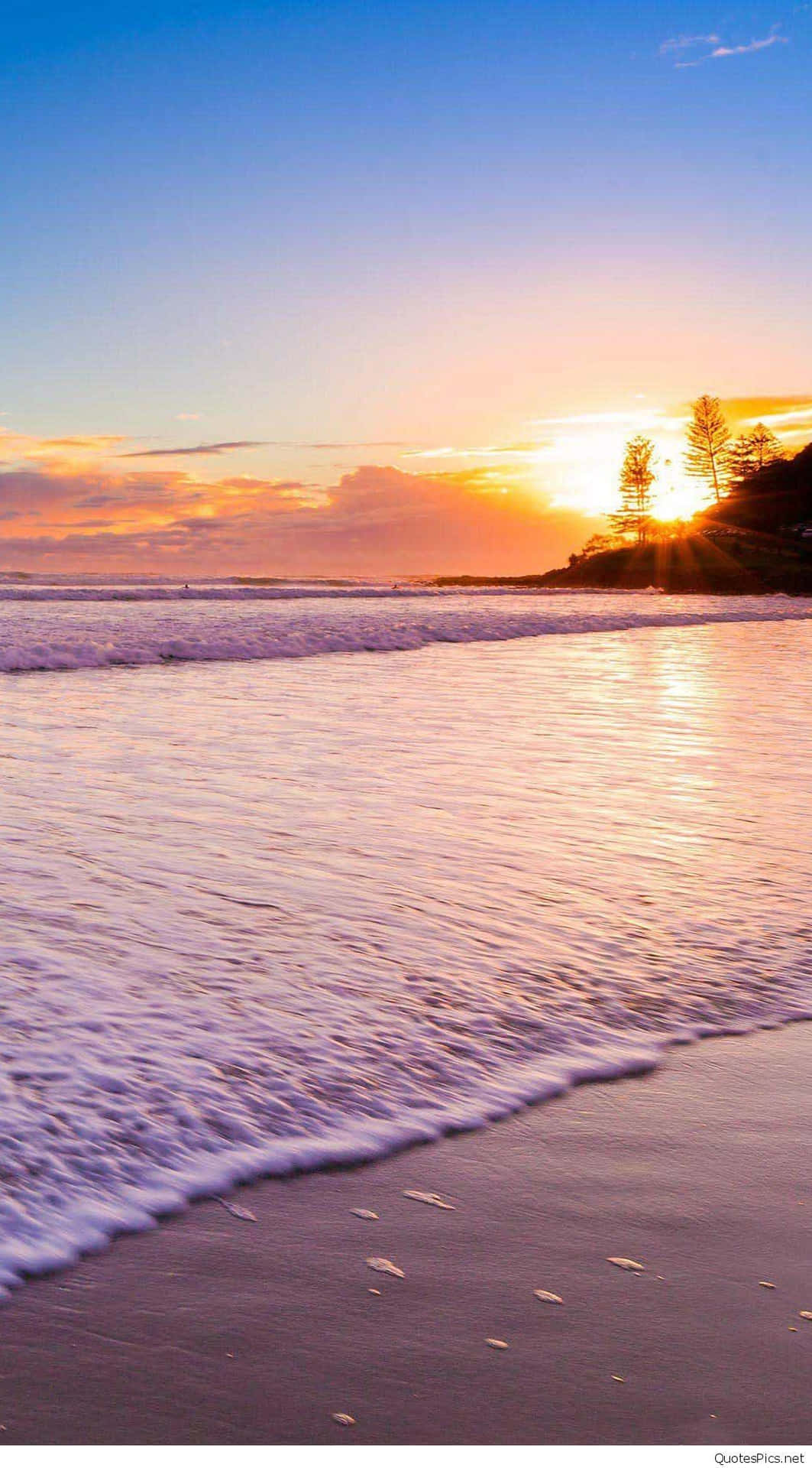 Witness The Breathtaking Beauty Of A Pink Beach Sunset. Background