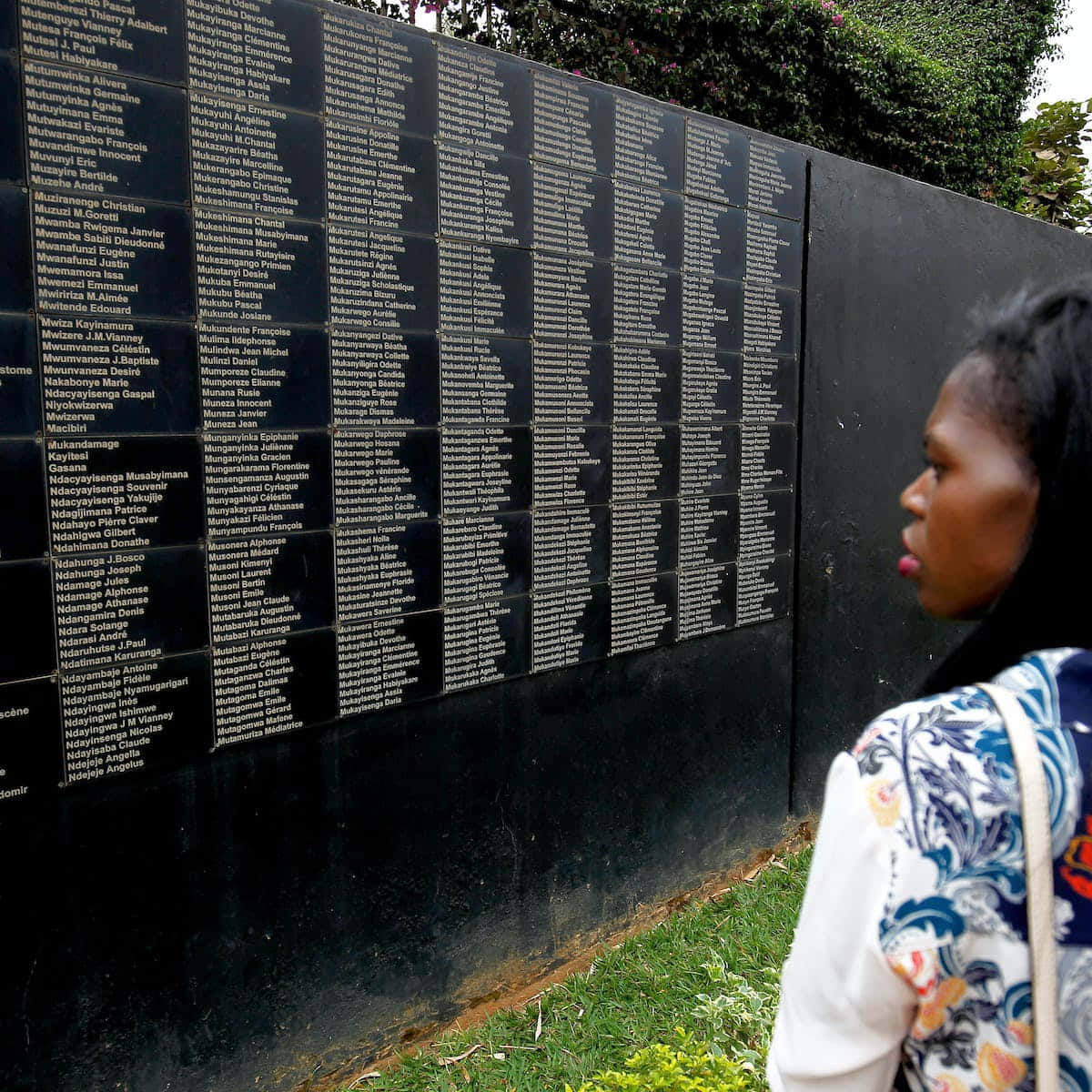 Woman At Kigali Genocide Memorial Black Wall Background