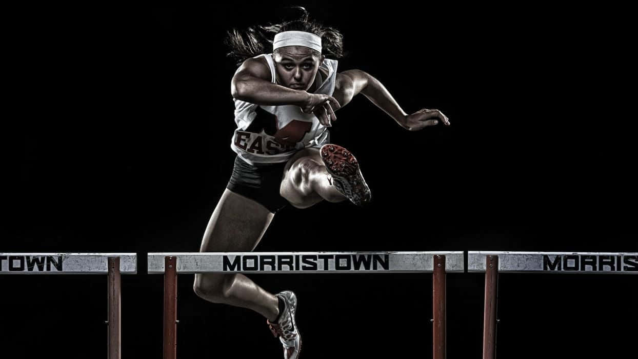 Woman Athlete In Hurdle Race