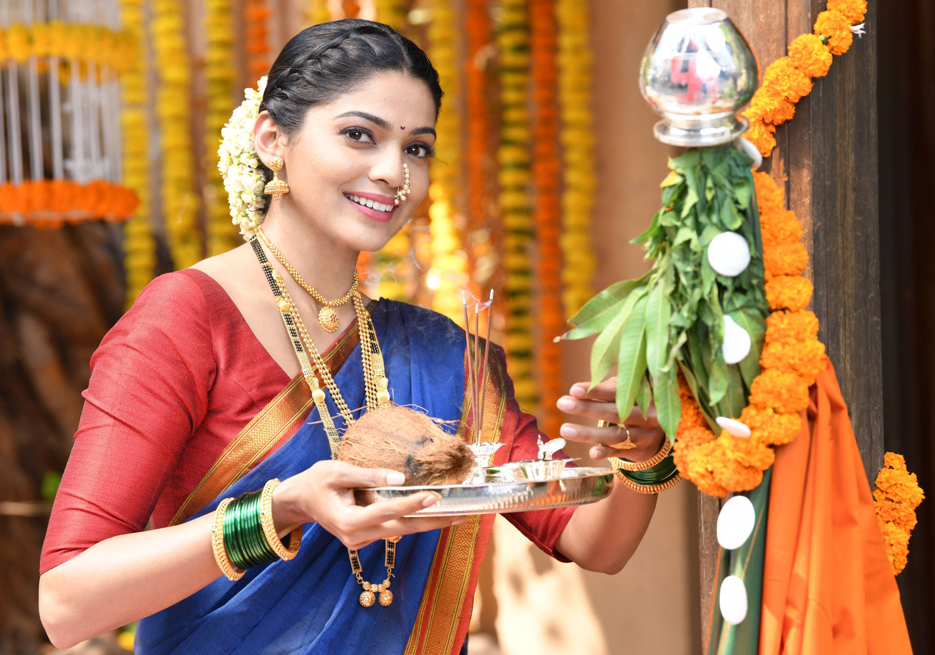 Woman Beside A Gudi Padwa Showpiece Background