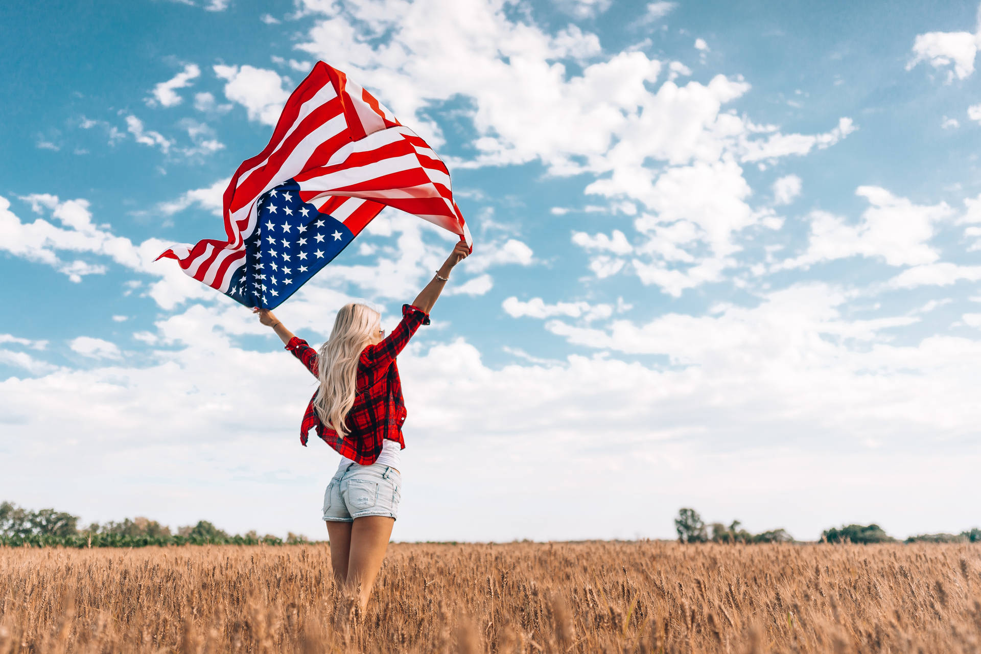 Woman Celebrating Freedom On Field Background