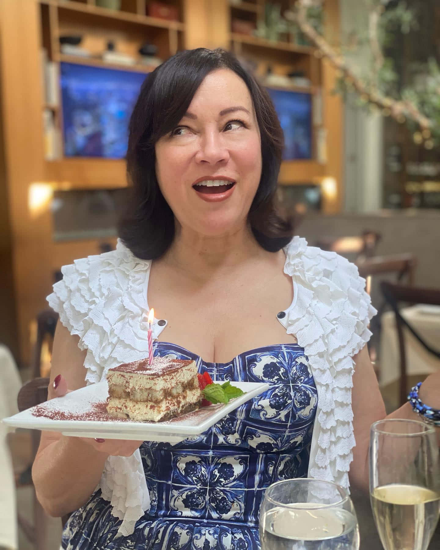 Woman Celebratingwith Birthday Cake Background