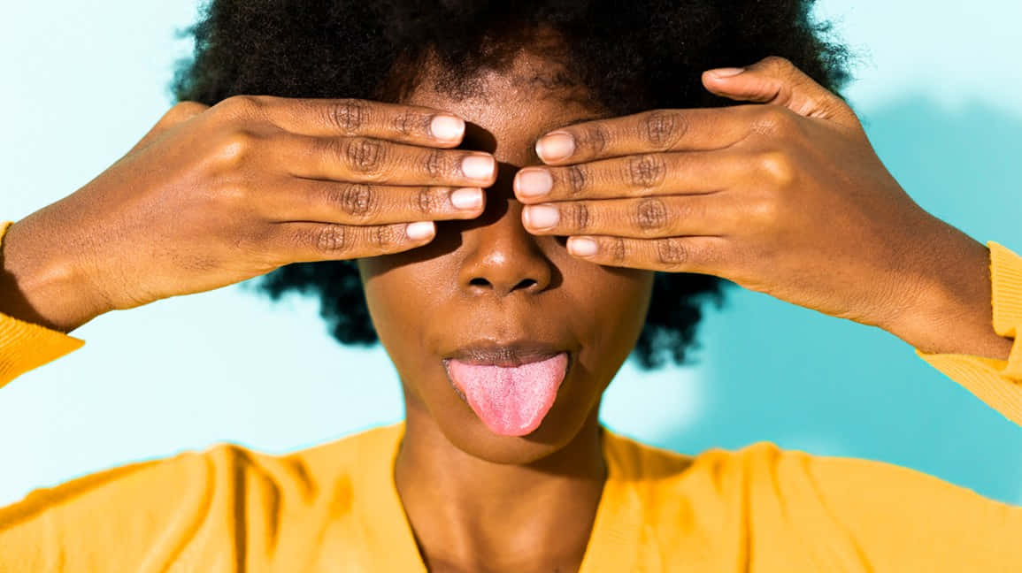 Woman Covering Eyes Tongue Out Background