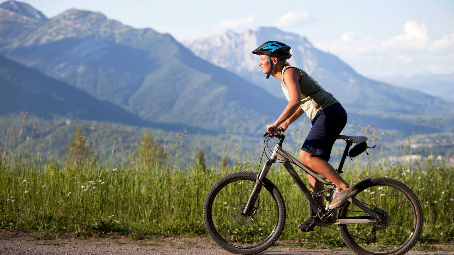 Woman Cyclist Terrain Mountain Biking Background