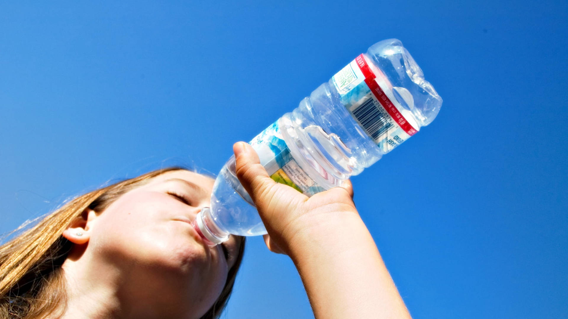 Woman Drinking Water From Bottle Background