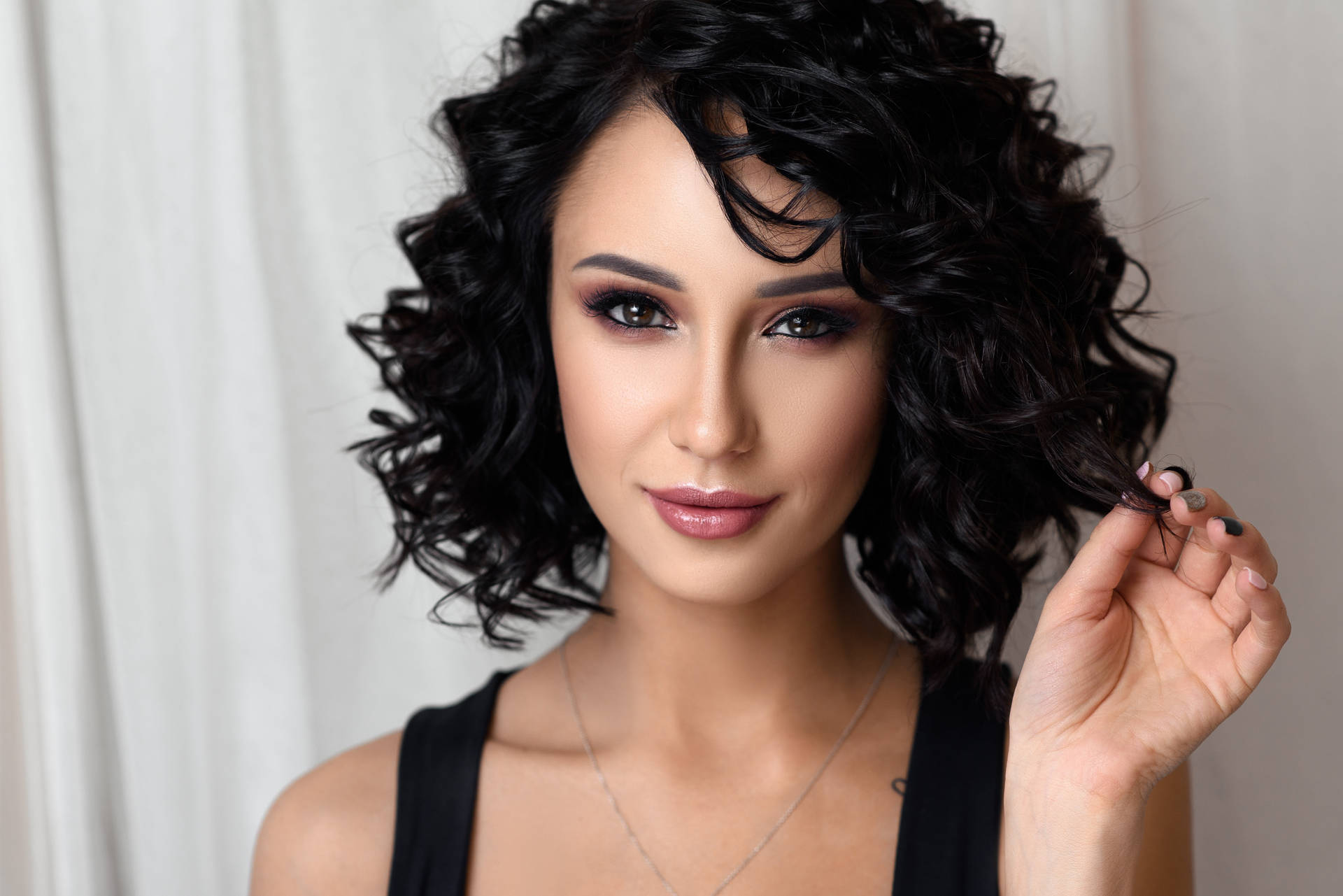 Woman Embracing Her Gorgeous Black Curls Background