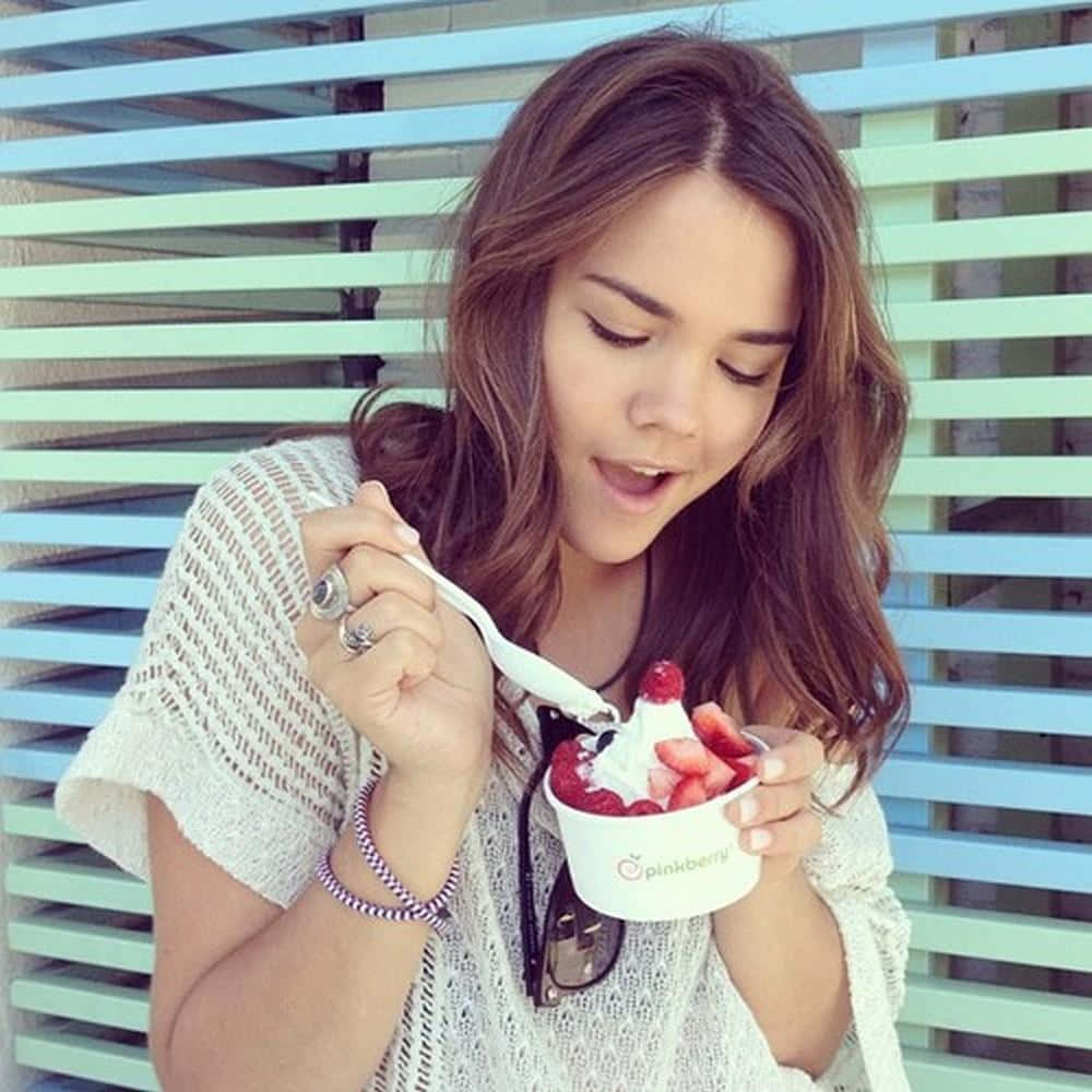 Woman Enjoying Frozen Yogurt Outdoors