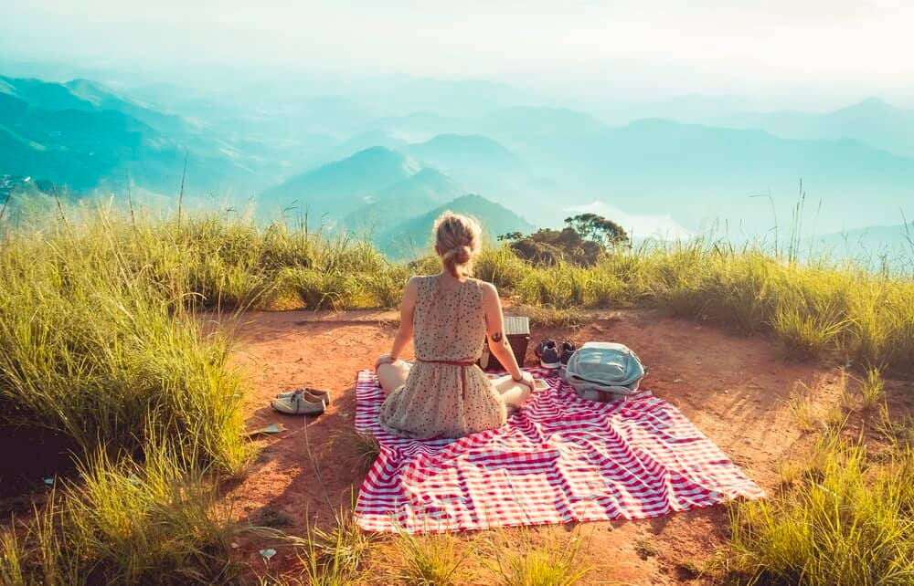 Woman Enjoying Life In The Mountains