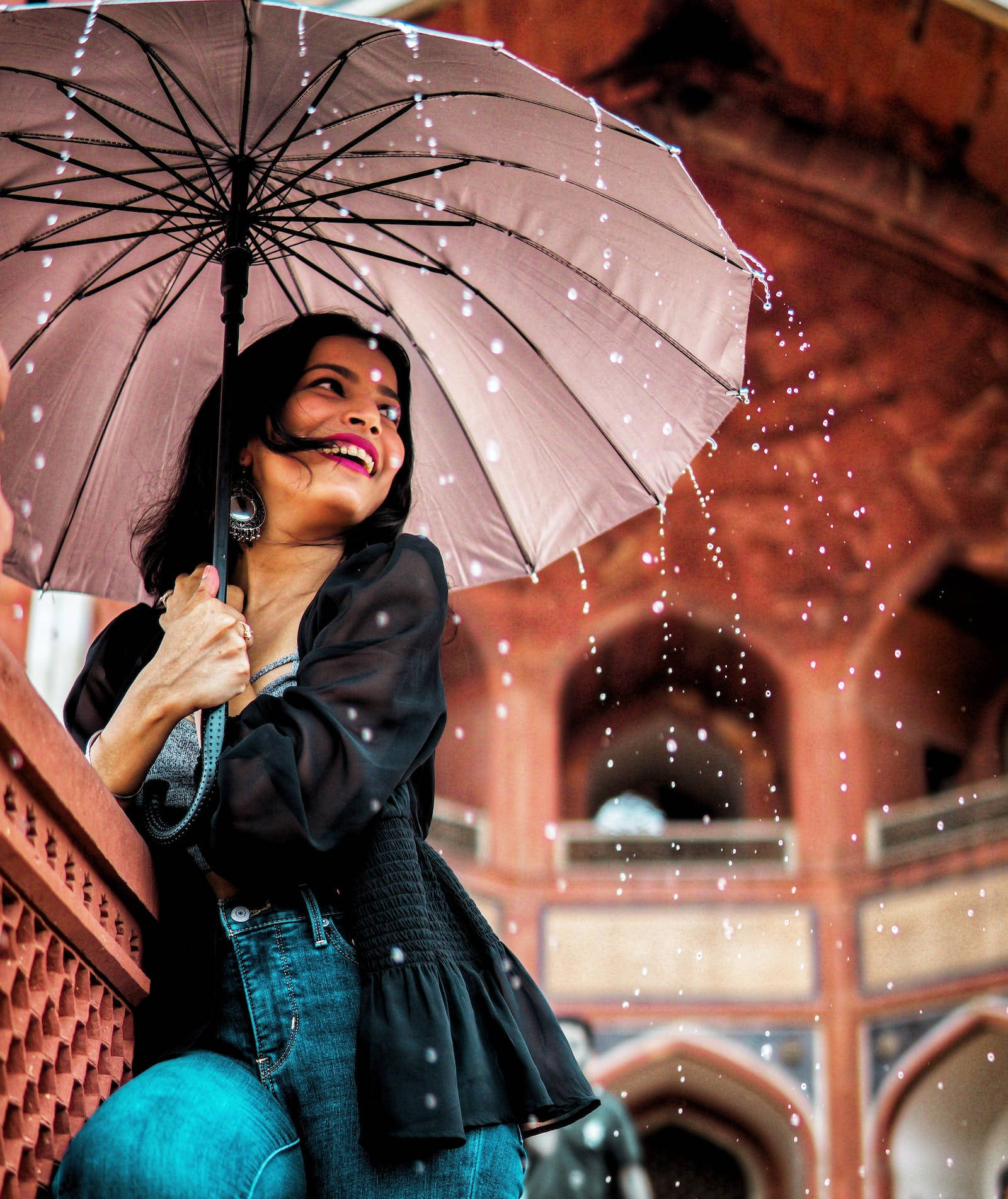 Woman Enjoying While It's Raining Background
