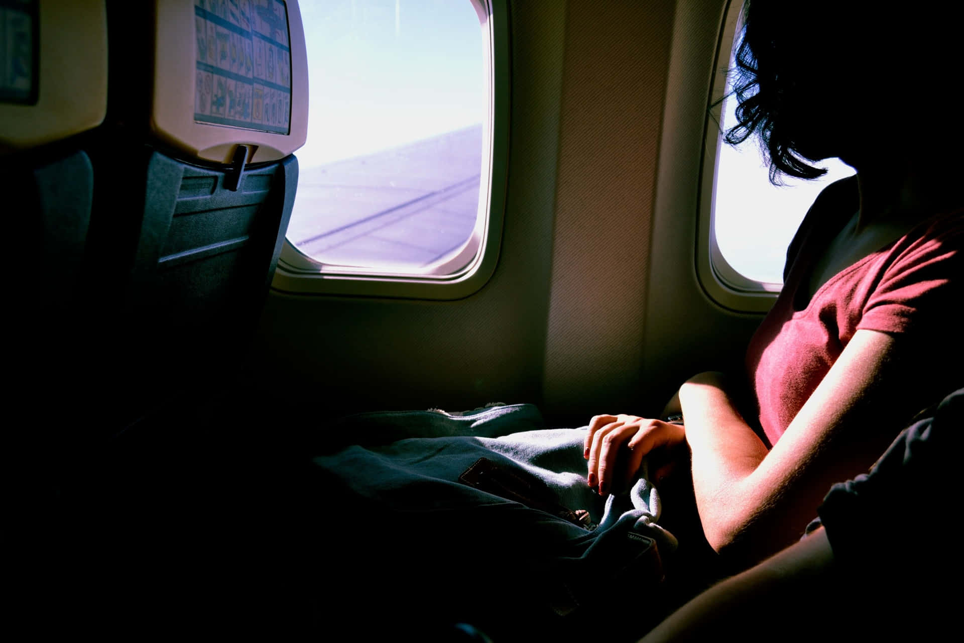 Woman Flying Solo Inside Airplane Background