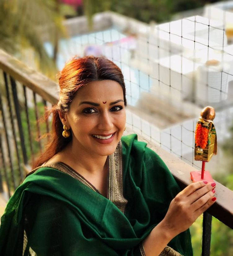 Woman Holding A Gudi Padwa Showpiece