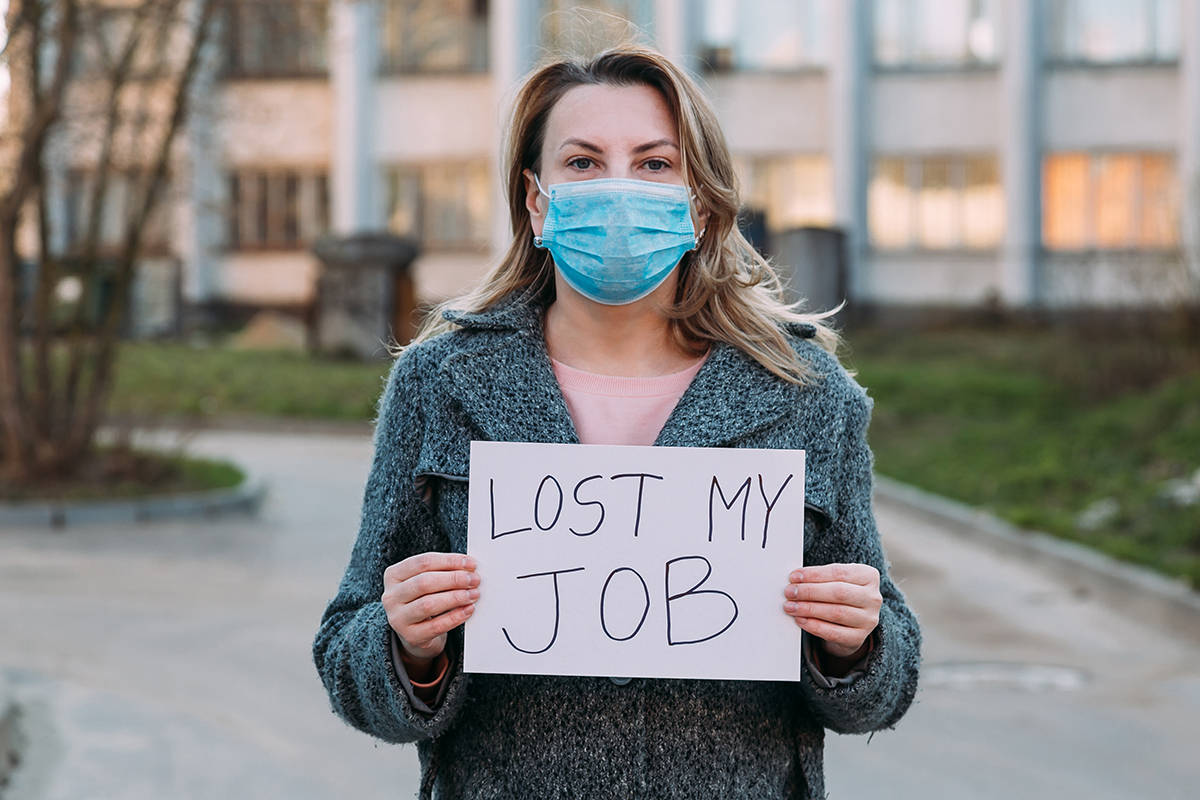 Woman Holding A Sign Of Unemployment During Pandemic Background