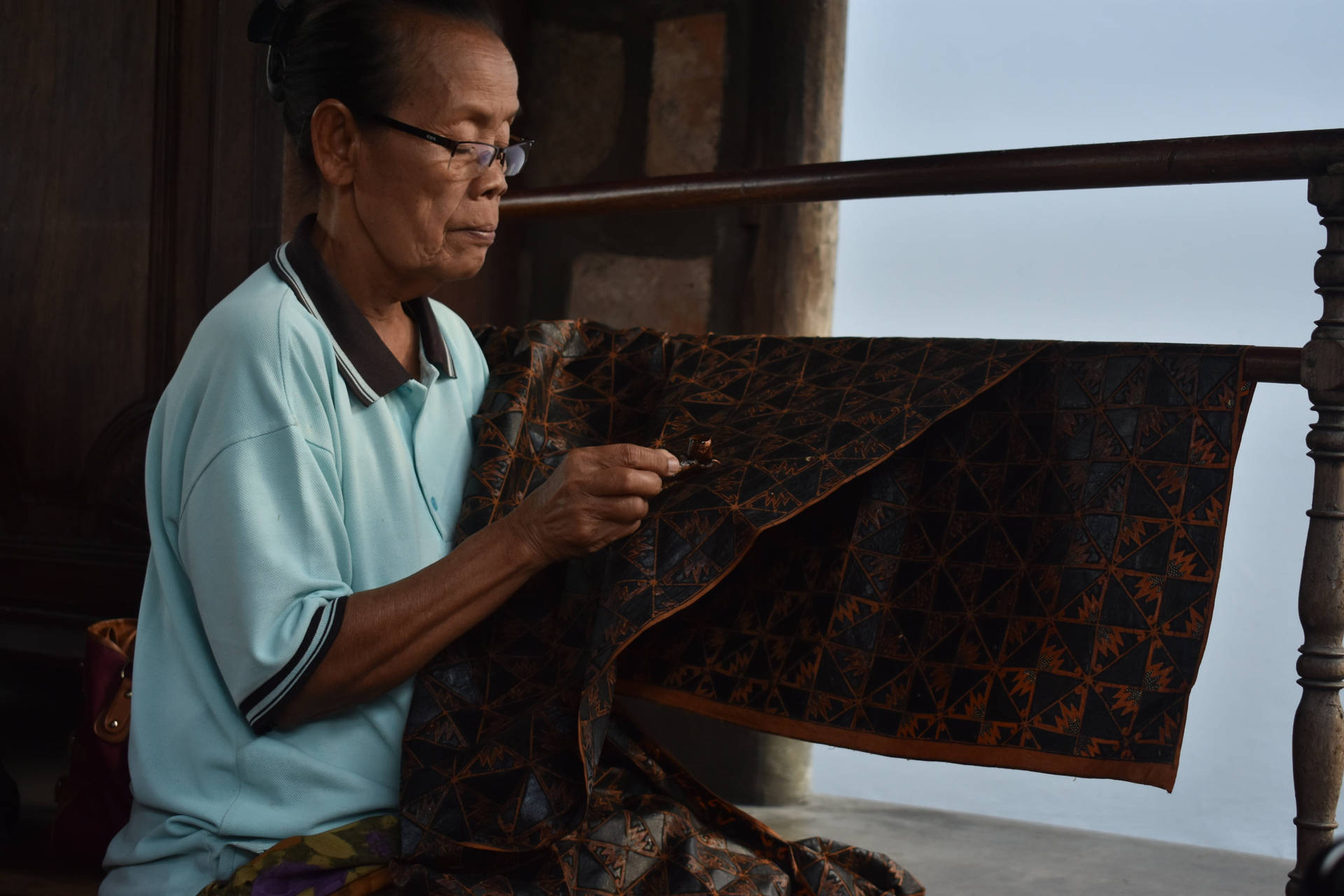 Woman Holding Batik Background