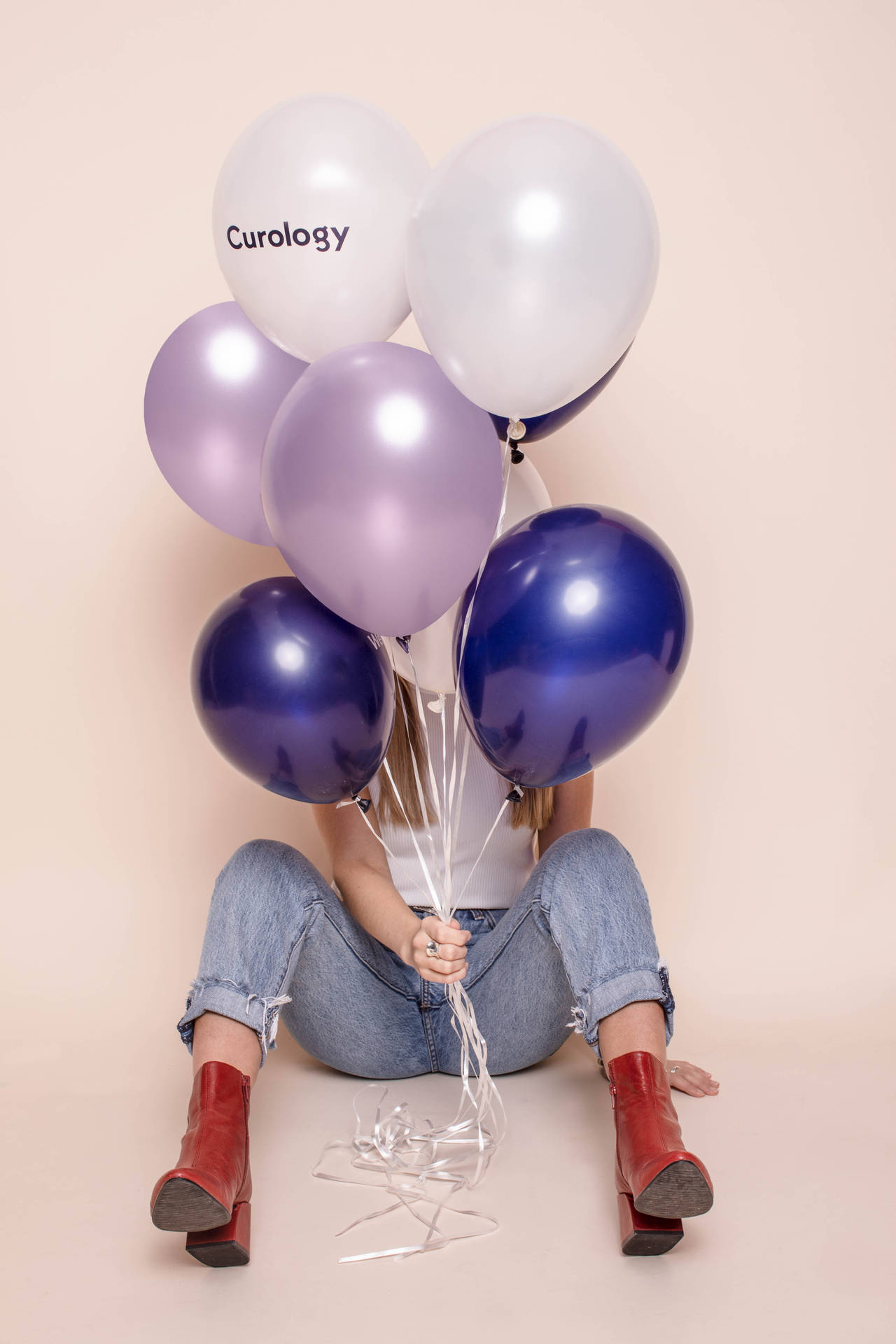 Woman Holding Glossy Balloons